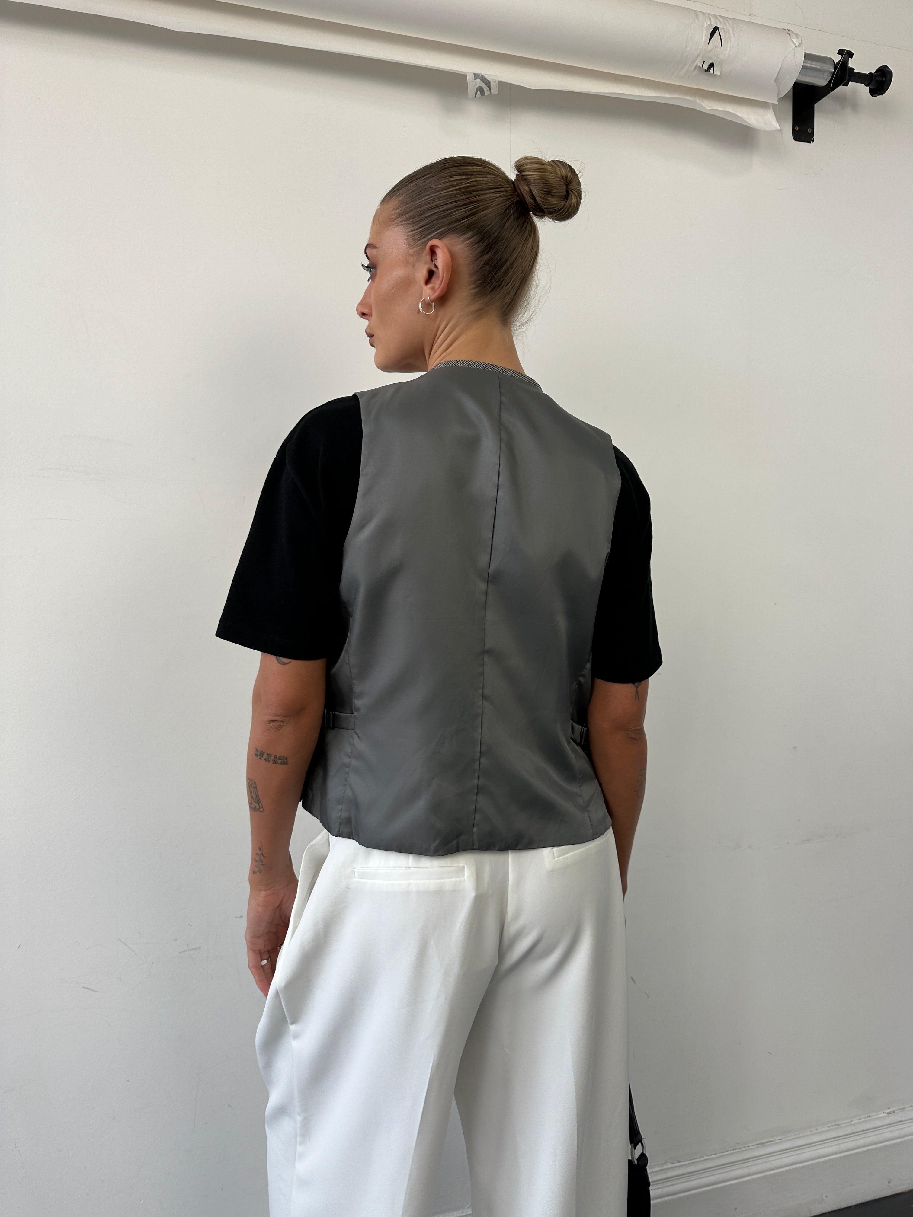 Vintage reversible wool tailored waistcoat in size M, showcasing classic design with detailed stitching and versatile style.