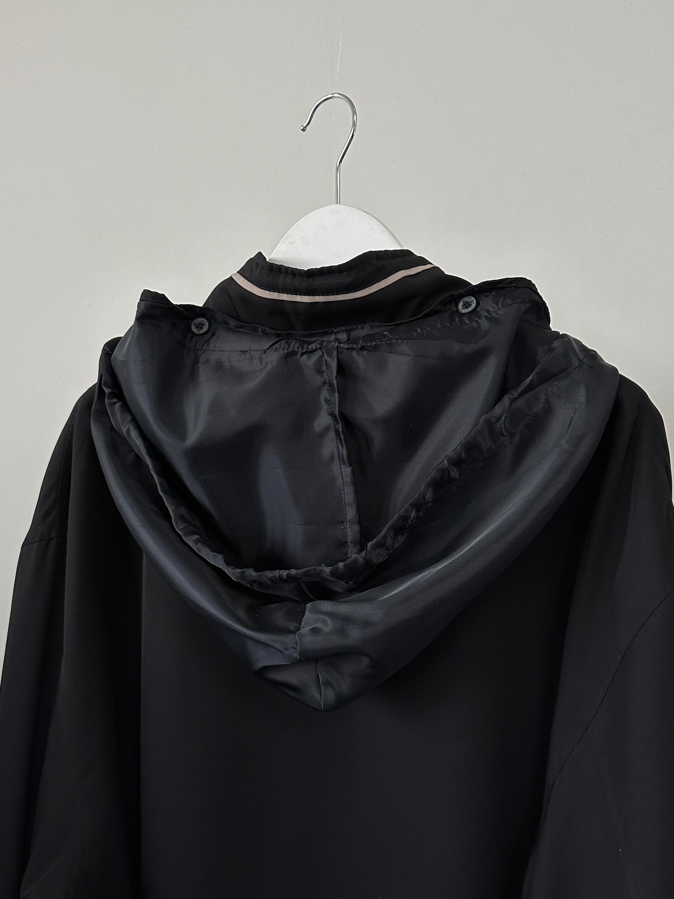 Yves Saint Laurent Pour Homme showerproof logo bomber jacket in XL/XXL, navy blue with YSL branding and ribbed cuffs.