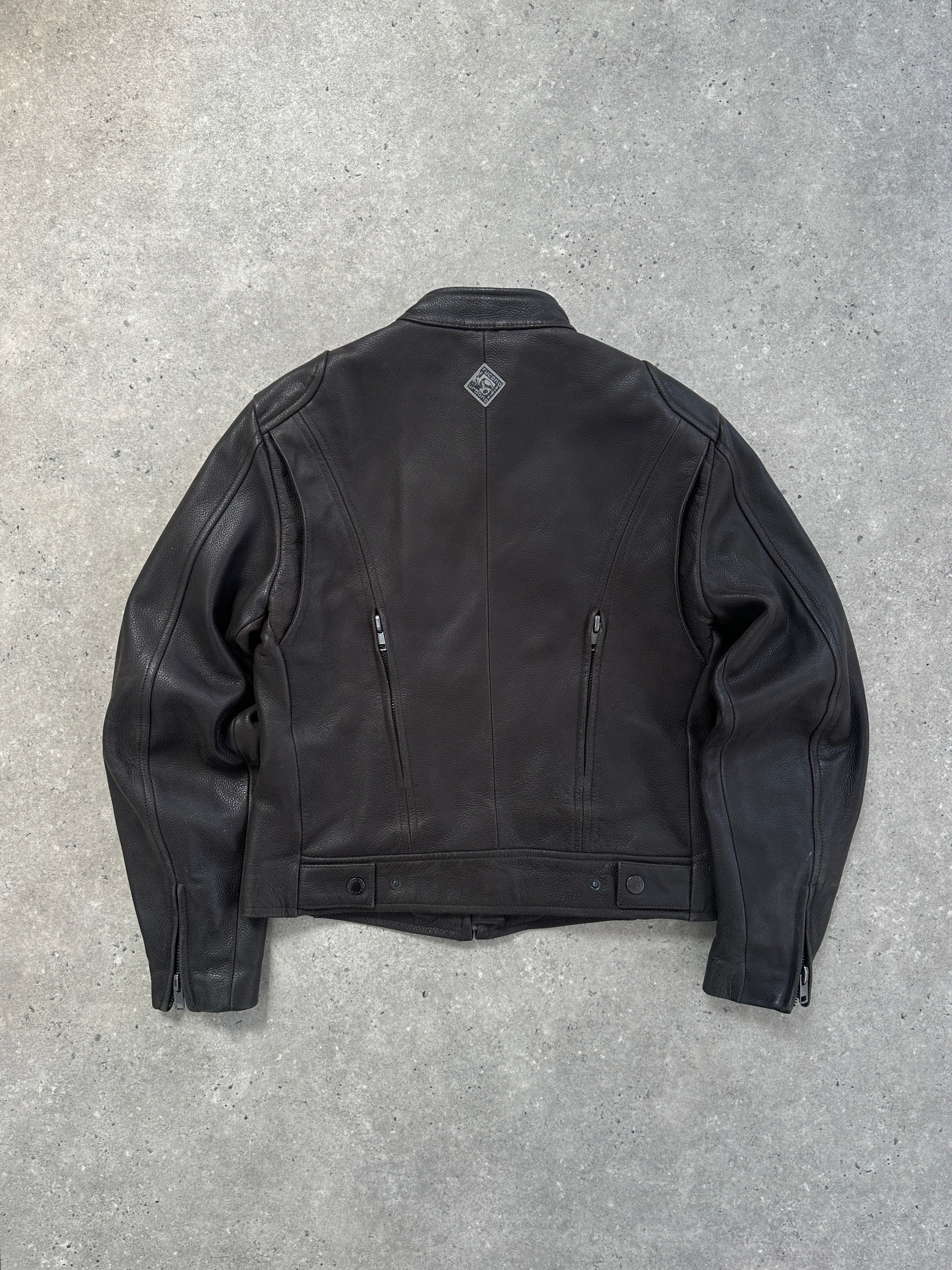 Vintage leather moto jacket in size S/M, featuring classic design with zipper details and distressed finish.