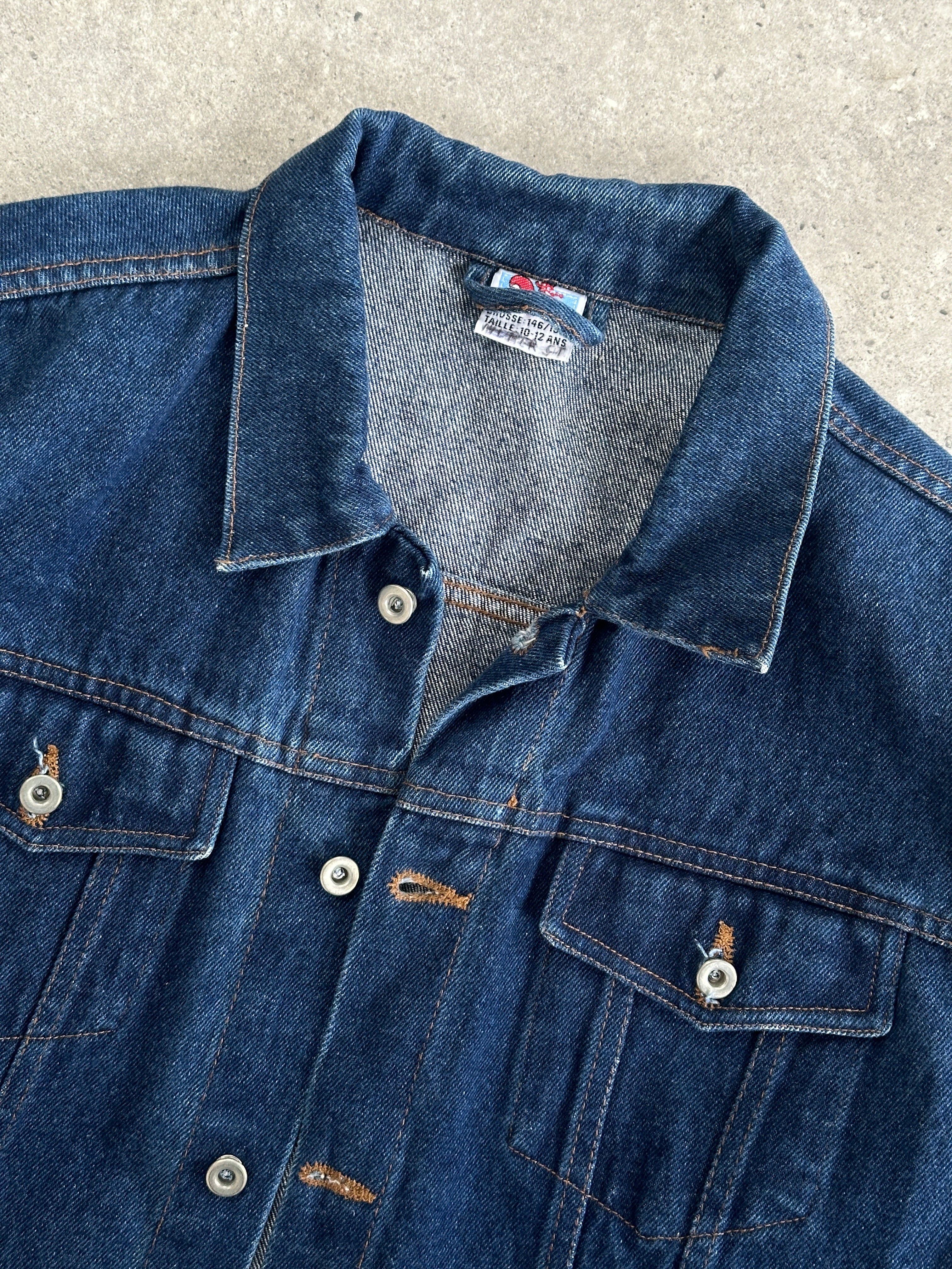 Vintage brand vintage indigo denim jacket, button-up style, in size XS/S, featuring classic denim fabric and retro design.