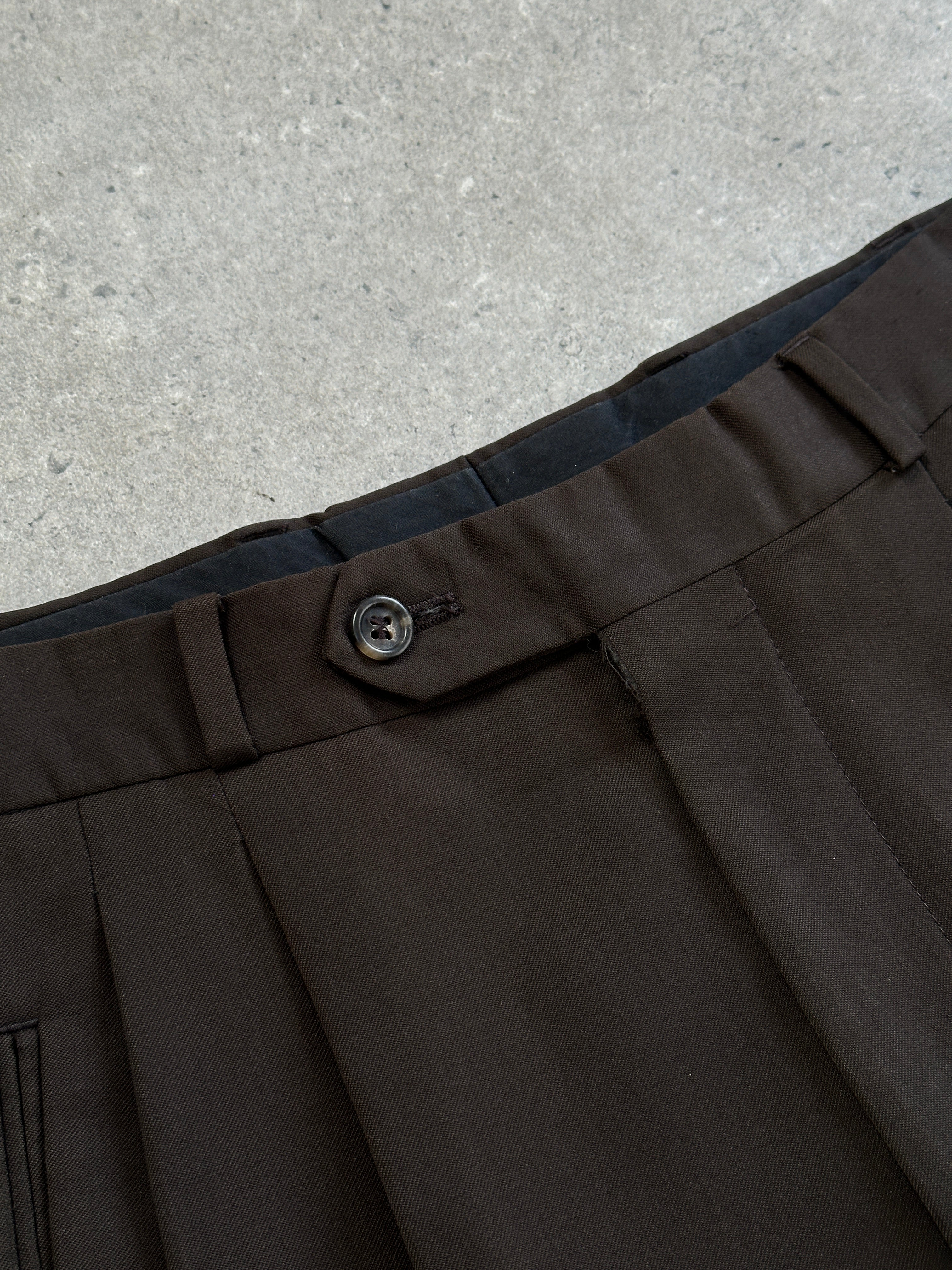 Yves Saint Laurent Pour Homme 1990s tailored wool trousers, W28, in classic dark color, featuring a structured fit and formal style.