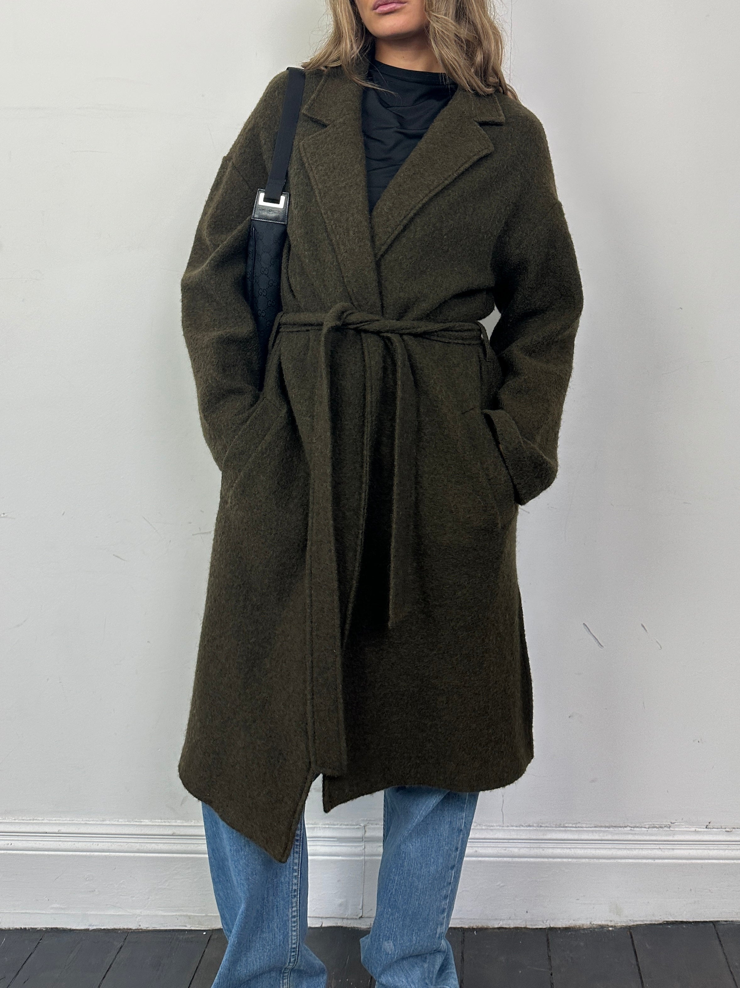 Nicole Farhi pure wool belted wrap coat, unlined, in size large, displayed on a hanger with a neutral background.