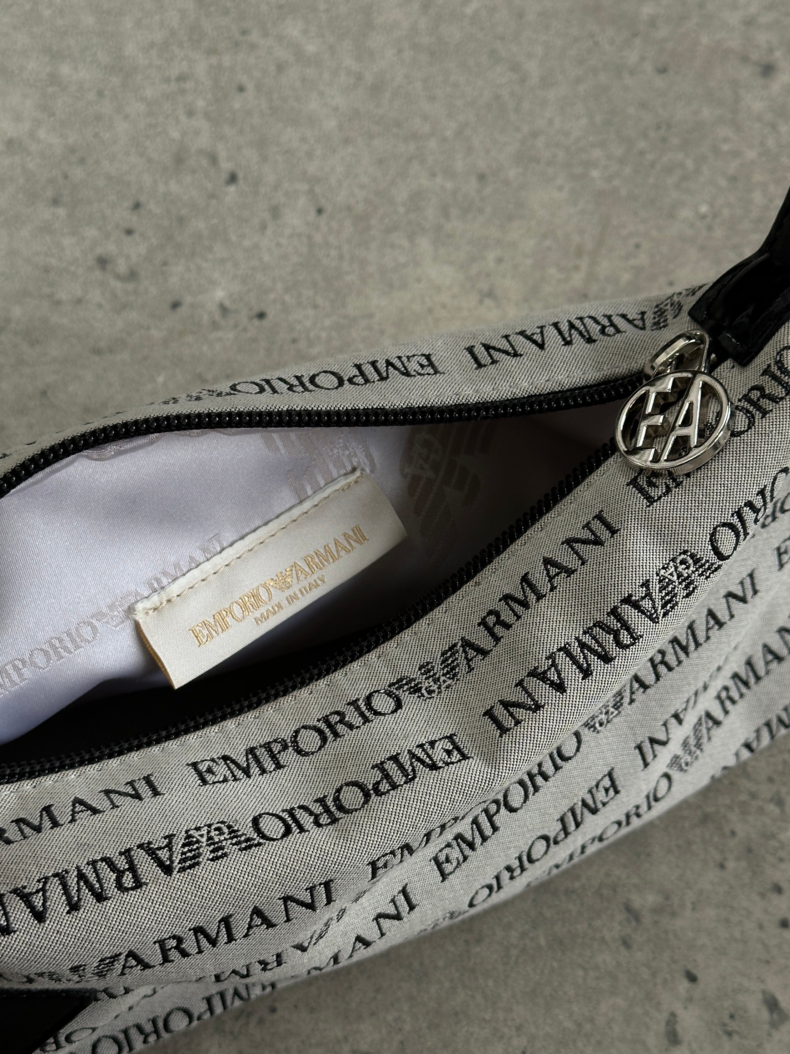 Emporio Armani Monogram Shoulder Bag featuring a sleek design with signature monogram pattern and adjustable shoulder strap.