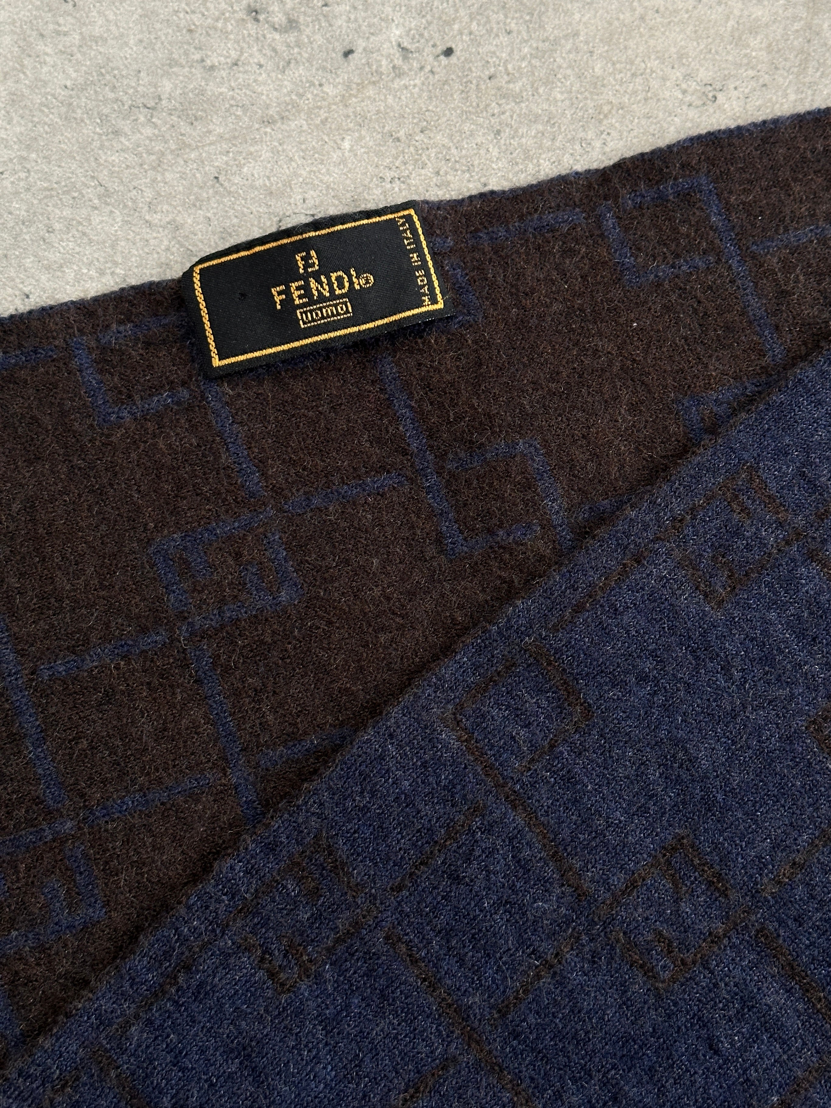 Fendi wool check scarf featuring classic pattern in neutral tones, ideal for stylish winter wear.