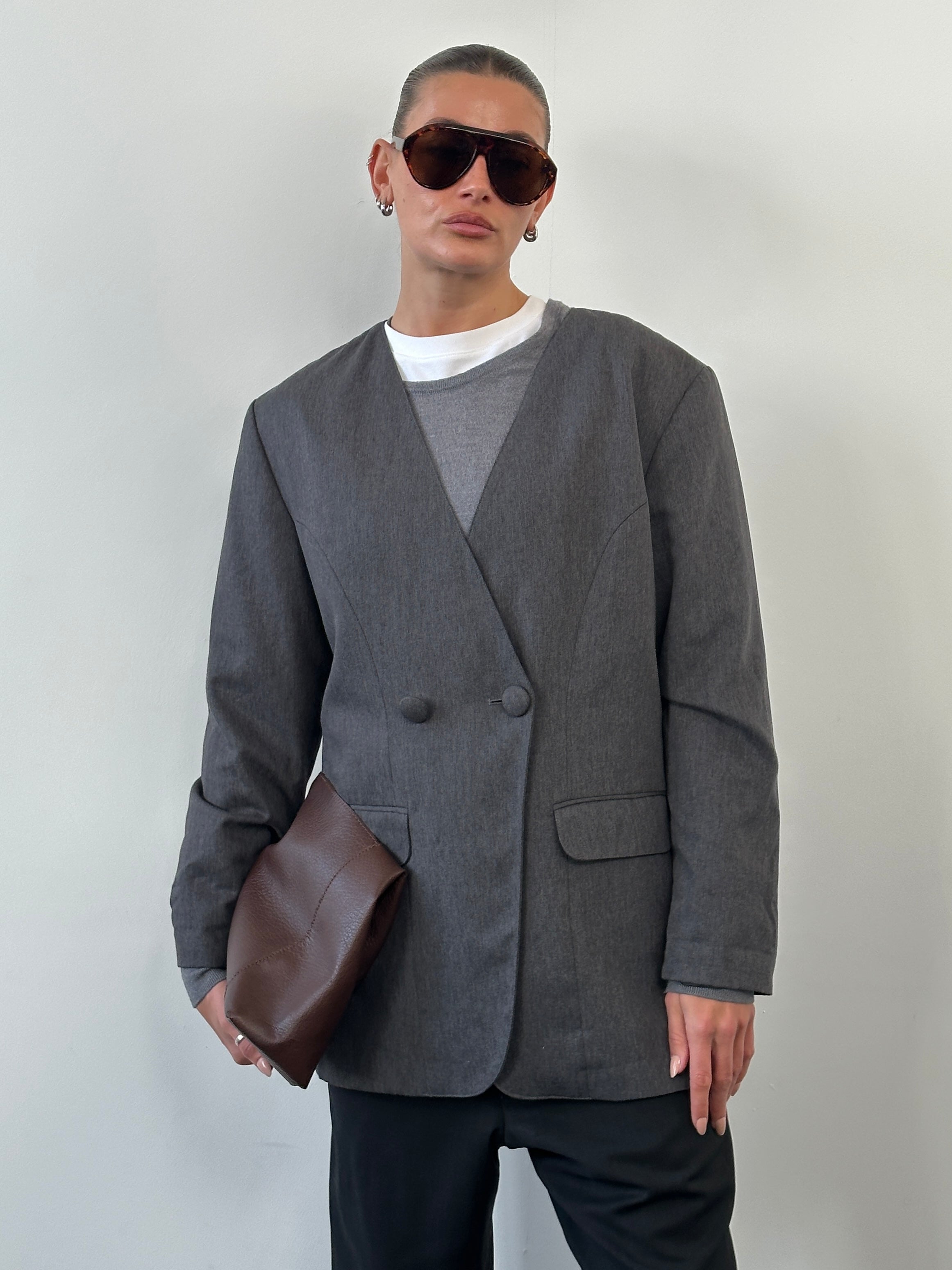 Vintage 1990s collarless blazer in black, minimal design, M/L size, classic vintage blazer for versatile style.
