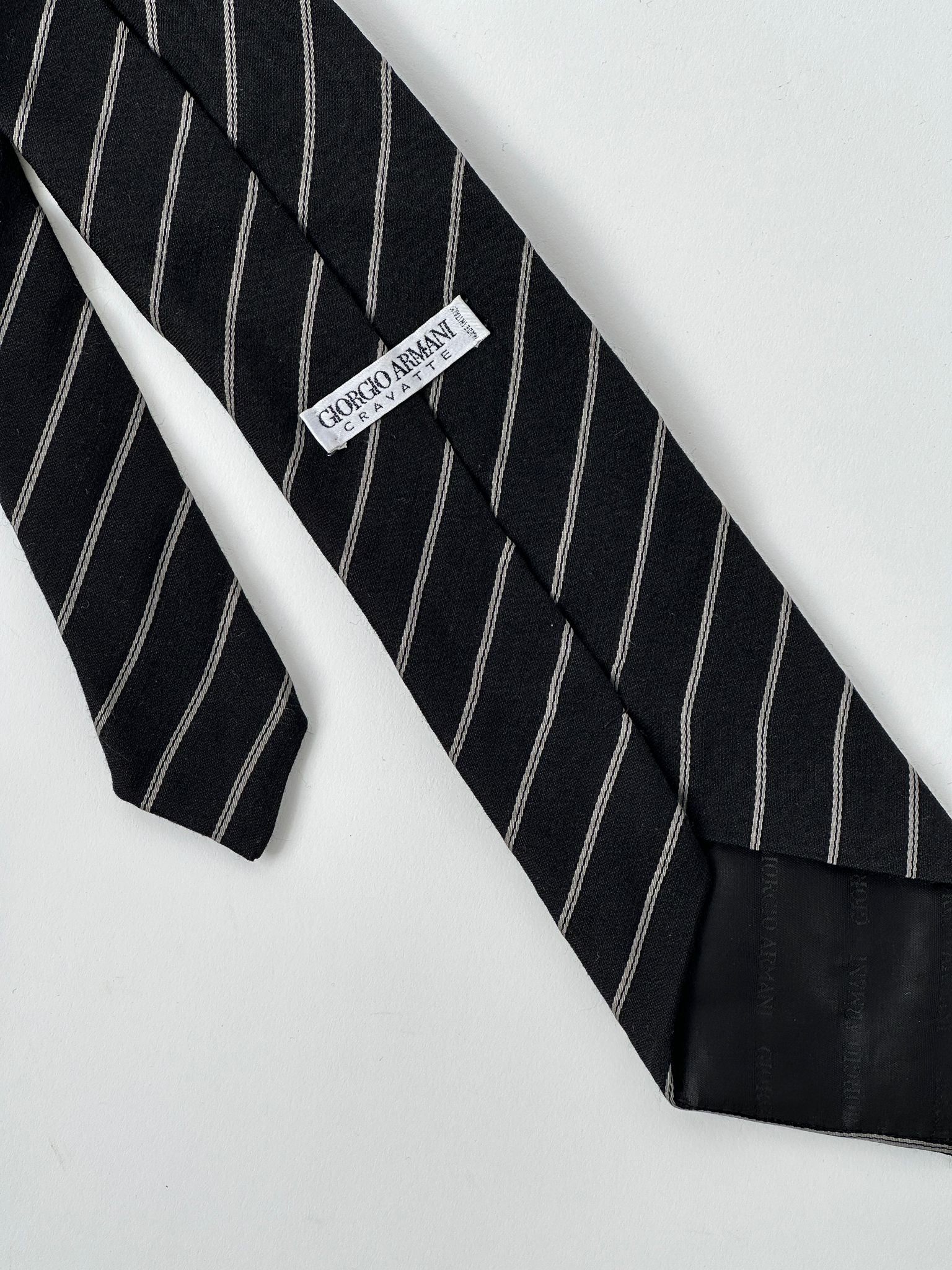 Giorgio Armani stripe silk wool tie featuring classic pattern and elegant design, perfect for formal or business attire.