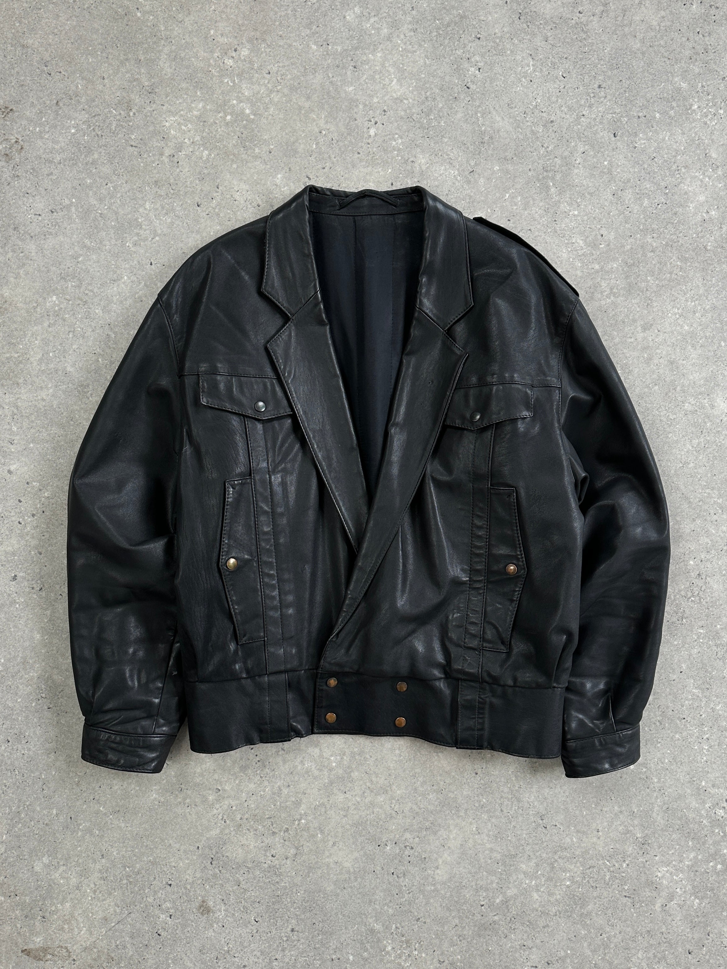 Vintage leather bomber jacket in size small, featuring classic design and durable construction.