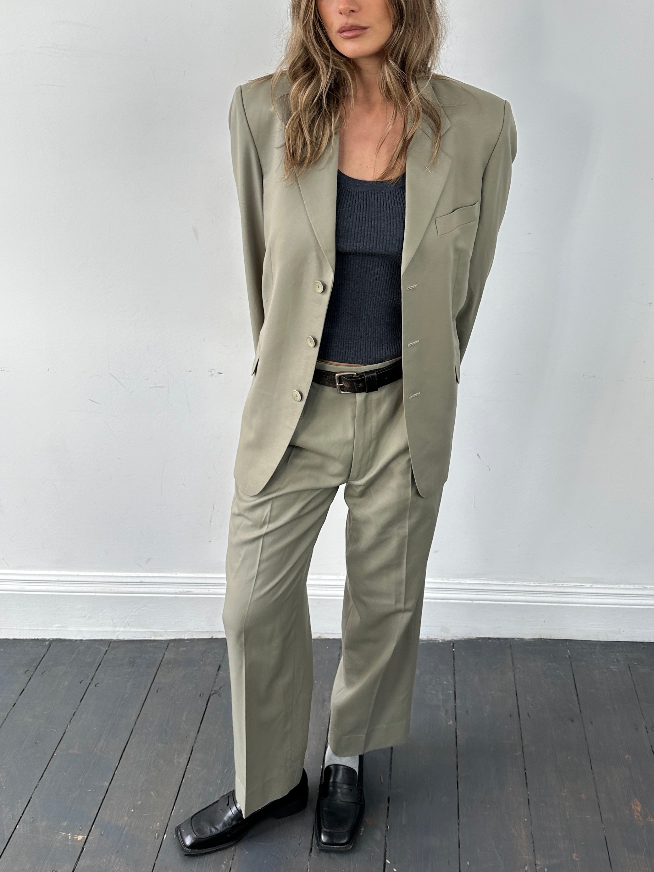 Vintage wool single-breasted suit jumpsuit in size 40R/W30, featuring classic tailored design and detailed stitching.