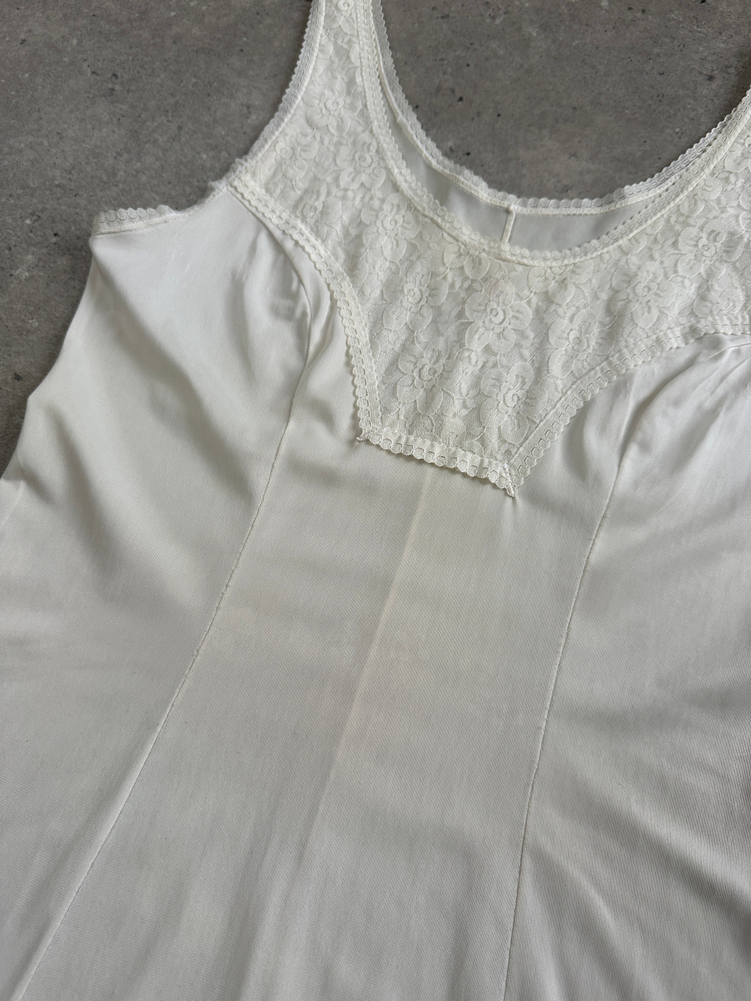 Vintage 1990s lace mini slip dress in size small, featuring delicate lace details and a classic vintage style.
