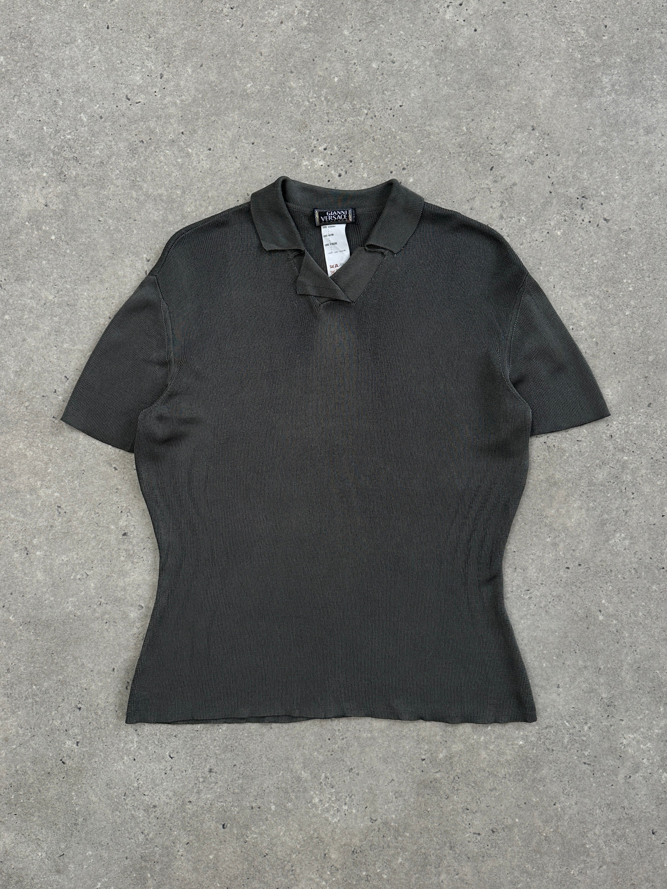 Gianni Versace Couture 1990s Polo Top in size M, featuring classic design with bold Versace branding and vibrant colors.