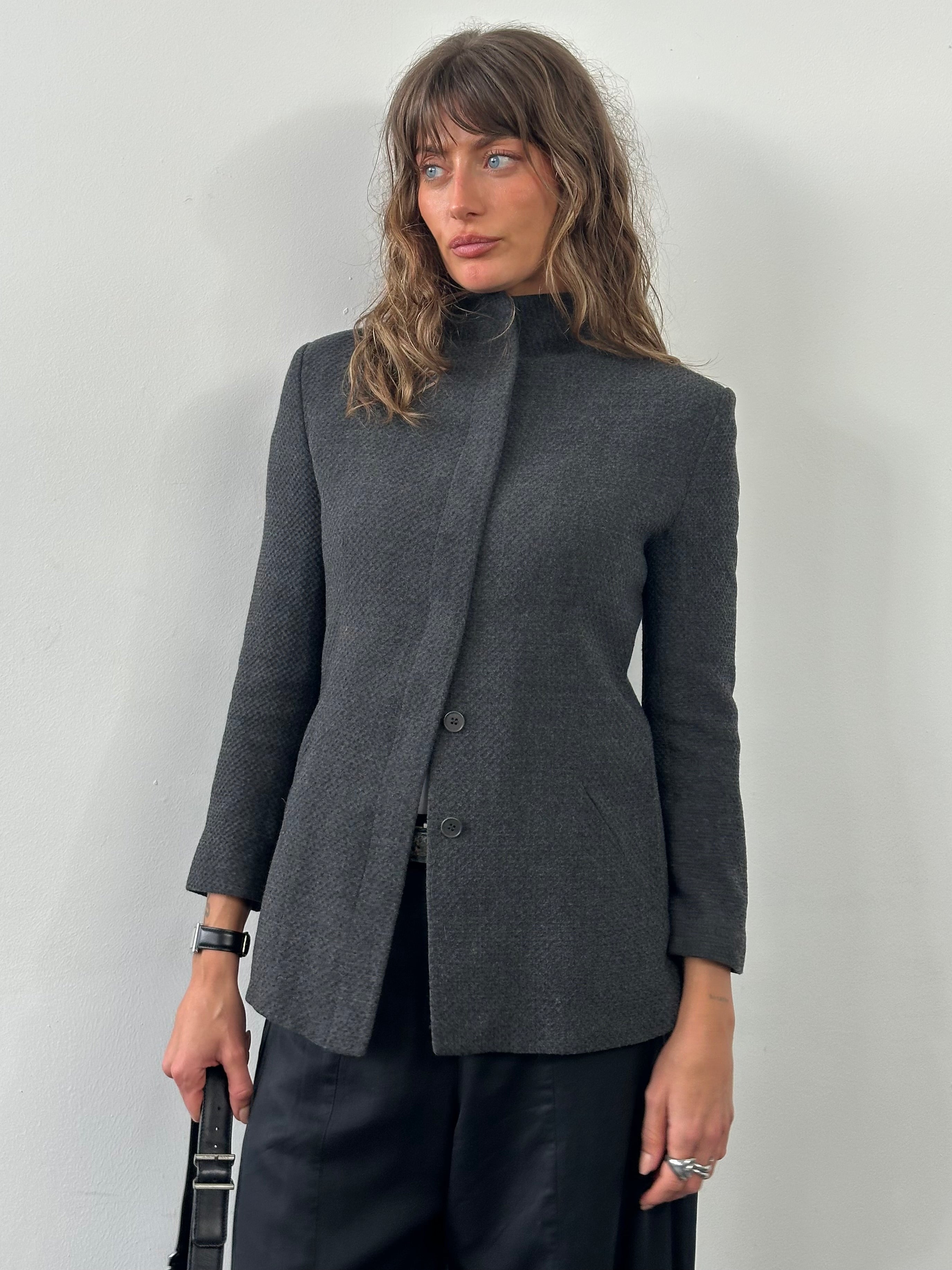 Emporio Armani 1990s high neck minimal jacket in XS/S, featuring sleek design and neutral color, displayed on a hanger.