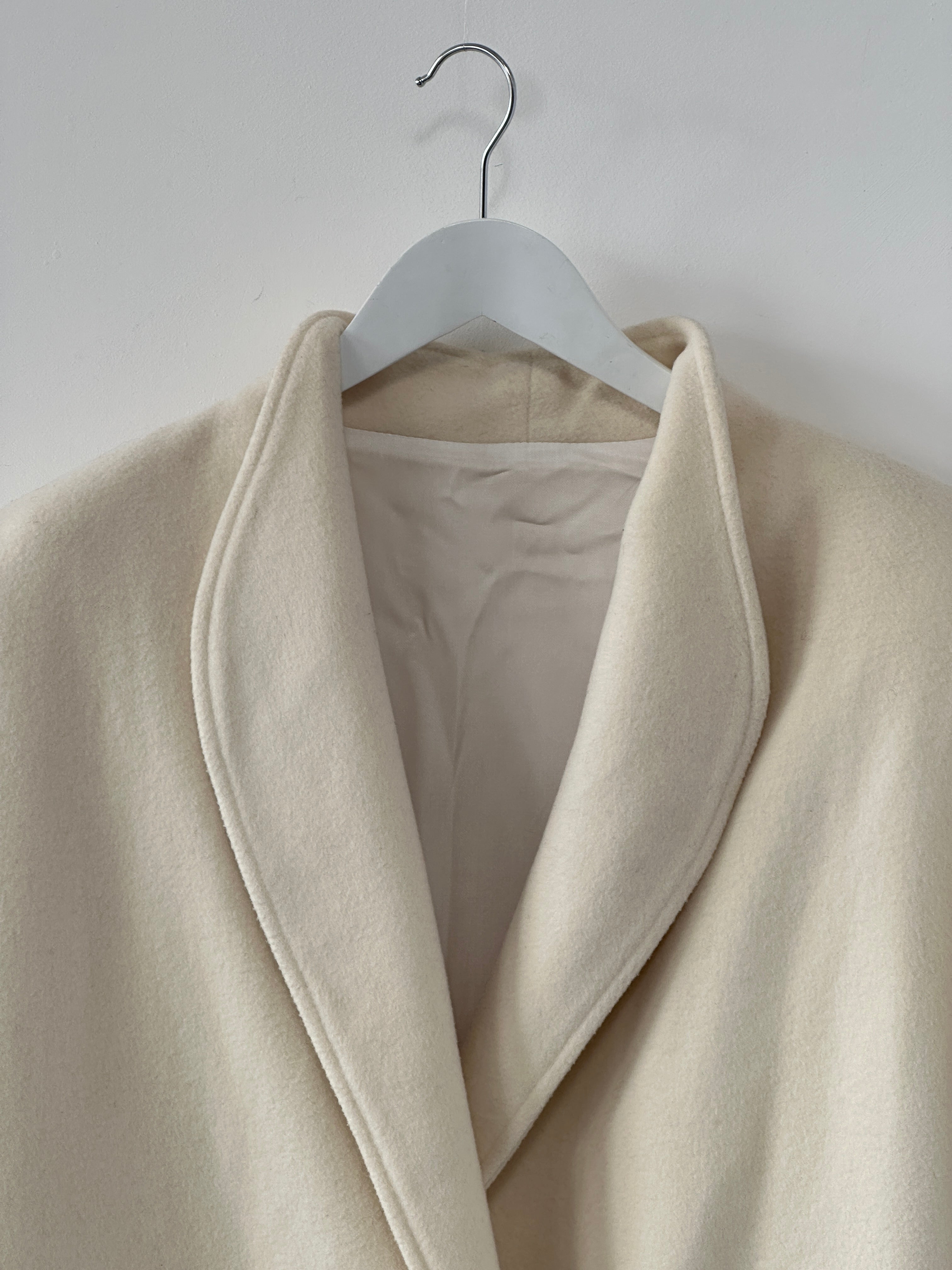 Vintage pure wool double-breasted coat in size L/XL, featuring classic design and tailored fit, displayed on a neutral background.
