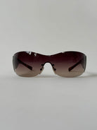 Prada Flame Rimless Wrap Sunglasses - SYLK
