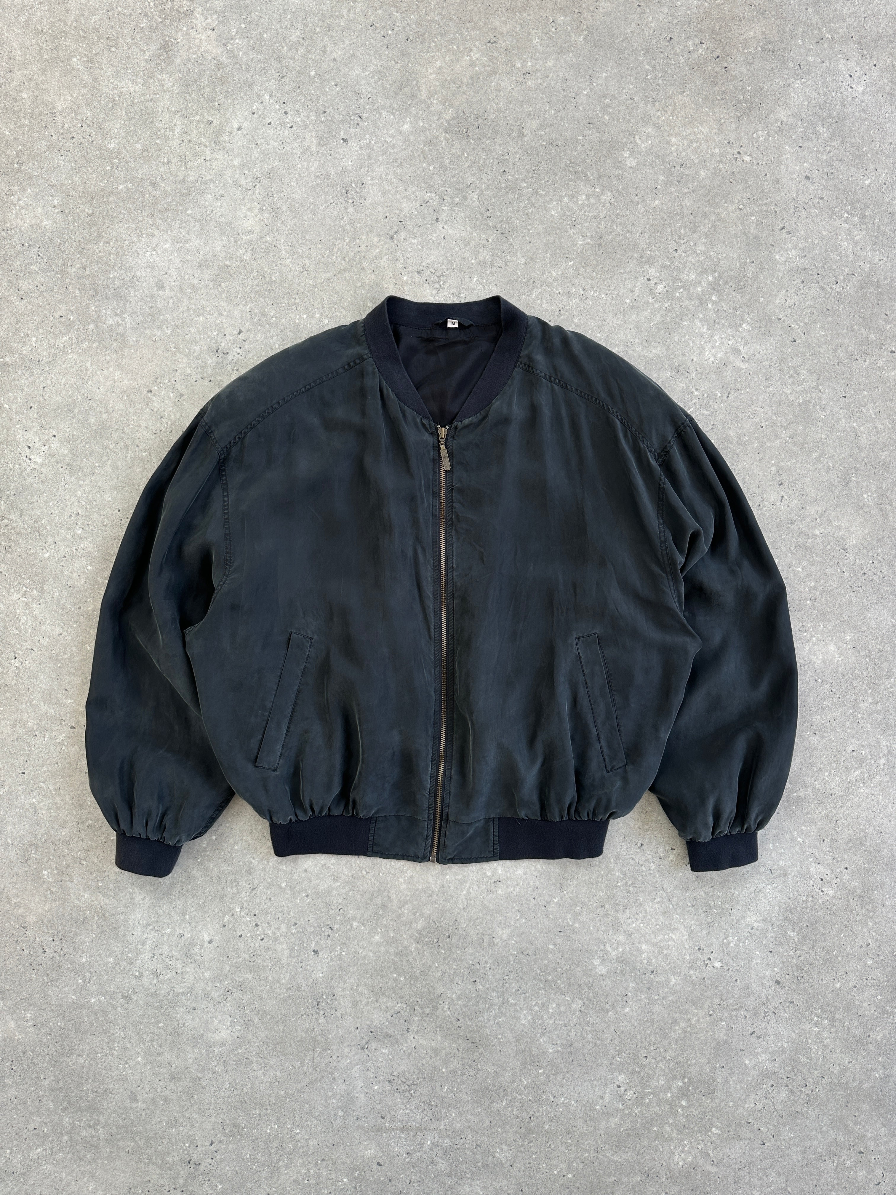 Vintage 1990s pure silk bomber jacket in size large, featuring a classic design with a smooth, shiny finish.
