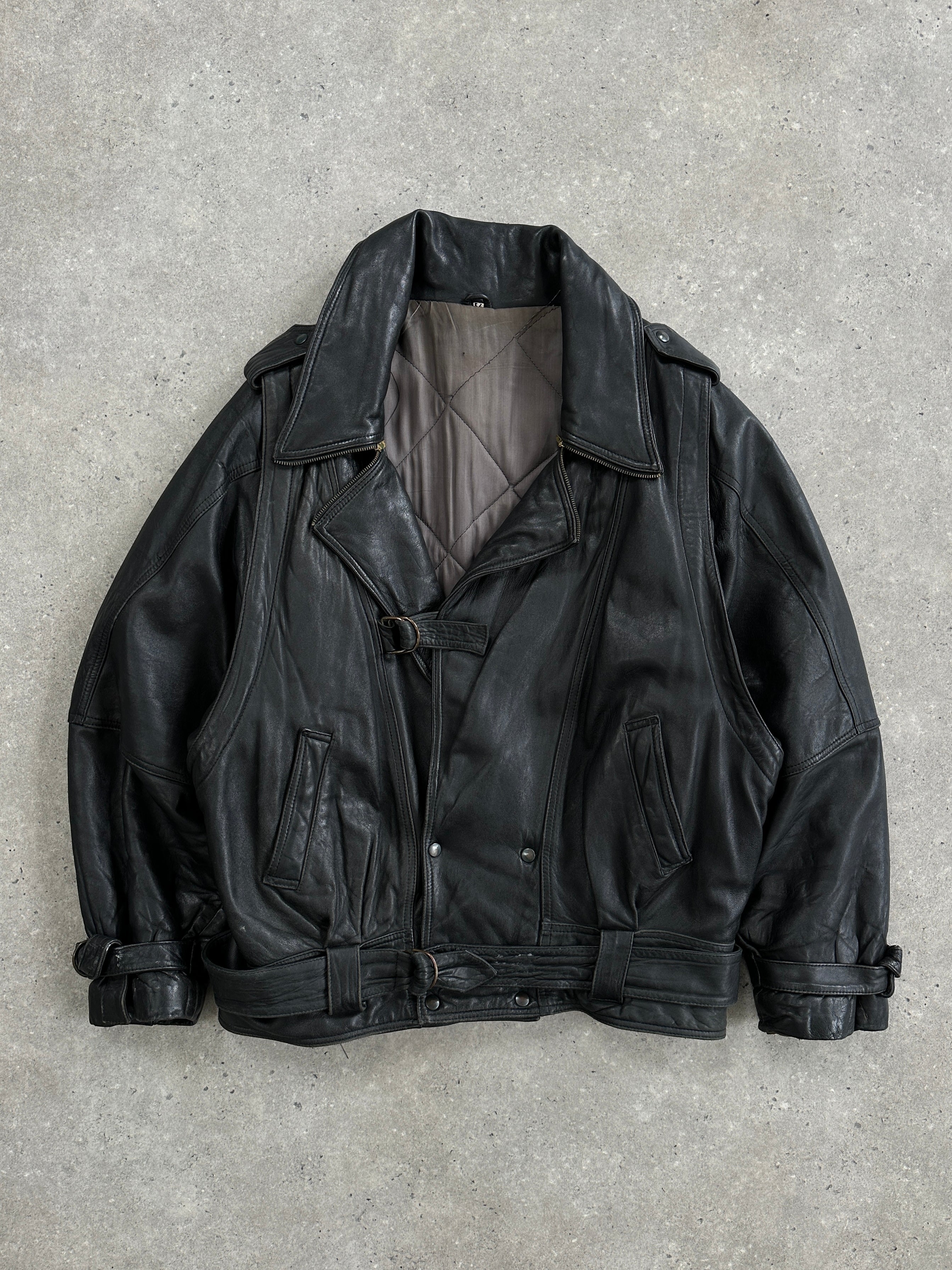 Vintage brand leather jacket with belted buckle design, in XL size, featuring classic styling and smooth leather texture.