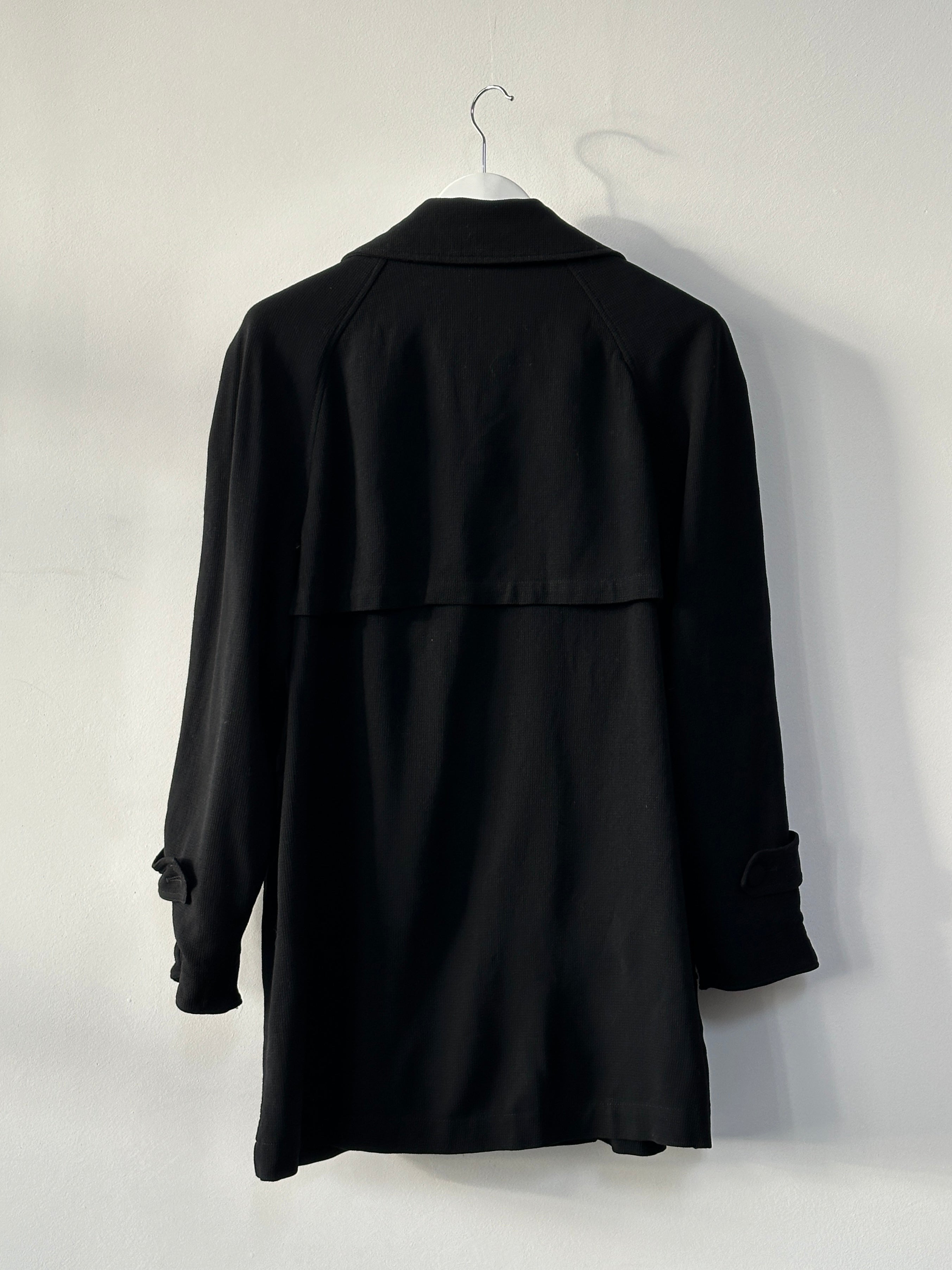 Moschino Couture 1990s pure wool double-breasted curved coat in size L, showcasing classic design and tailored fit.