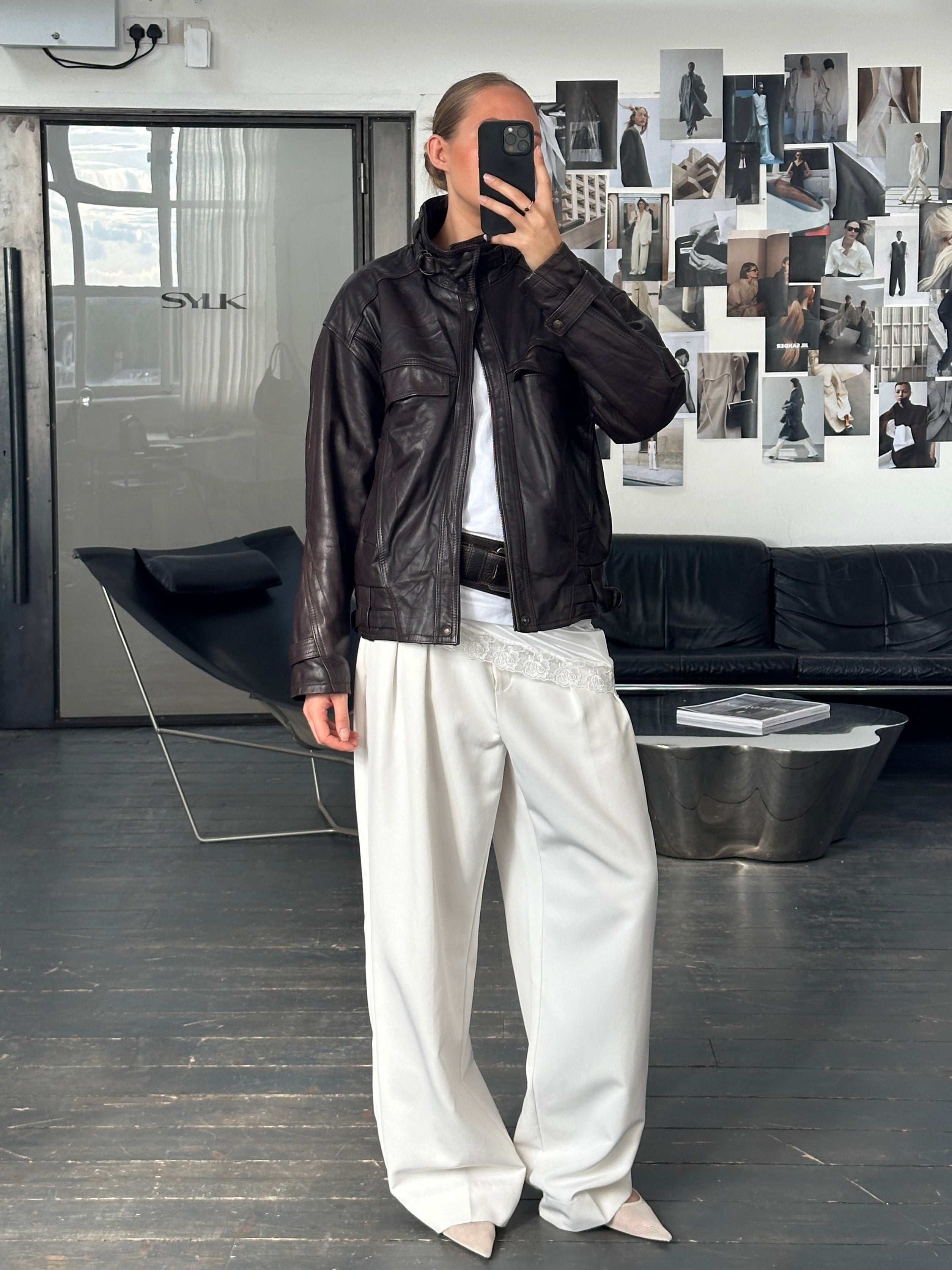 Vintage French 1980s high neck leather bomber jacket, stylish menswear with classic design and textured leather details.