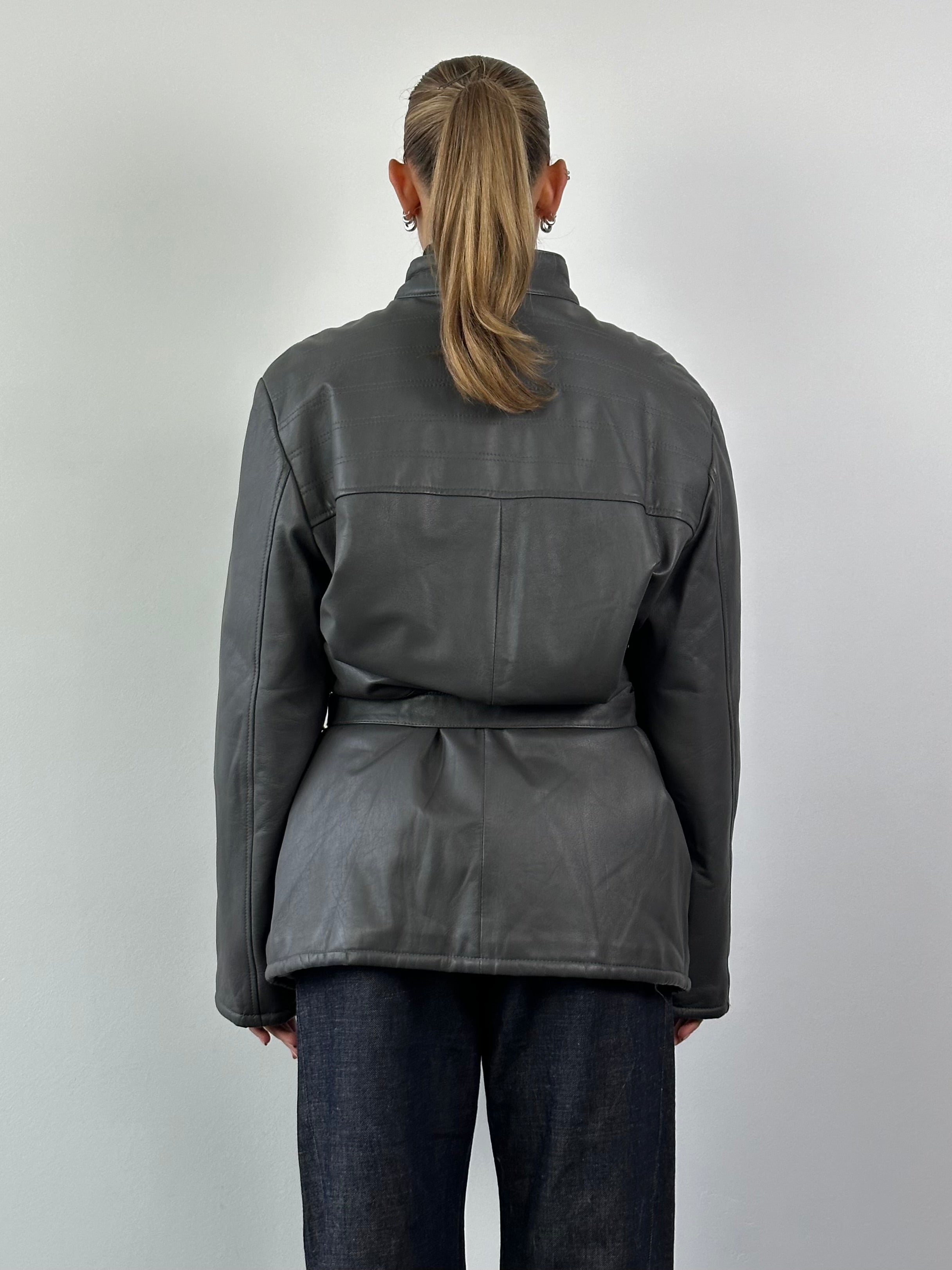 Vintage Italian vintage leather jacket with belt, size XL, featuring classic design and rich brown leather.