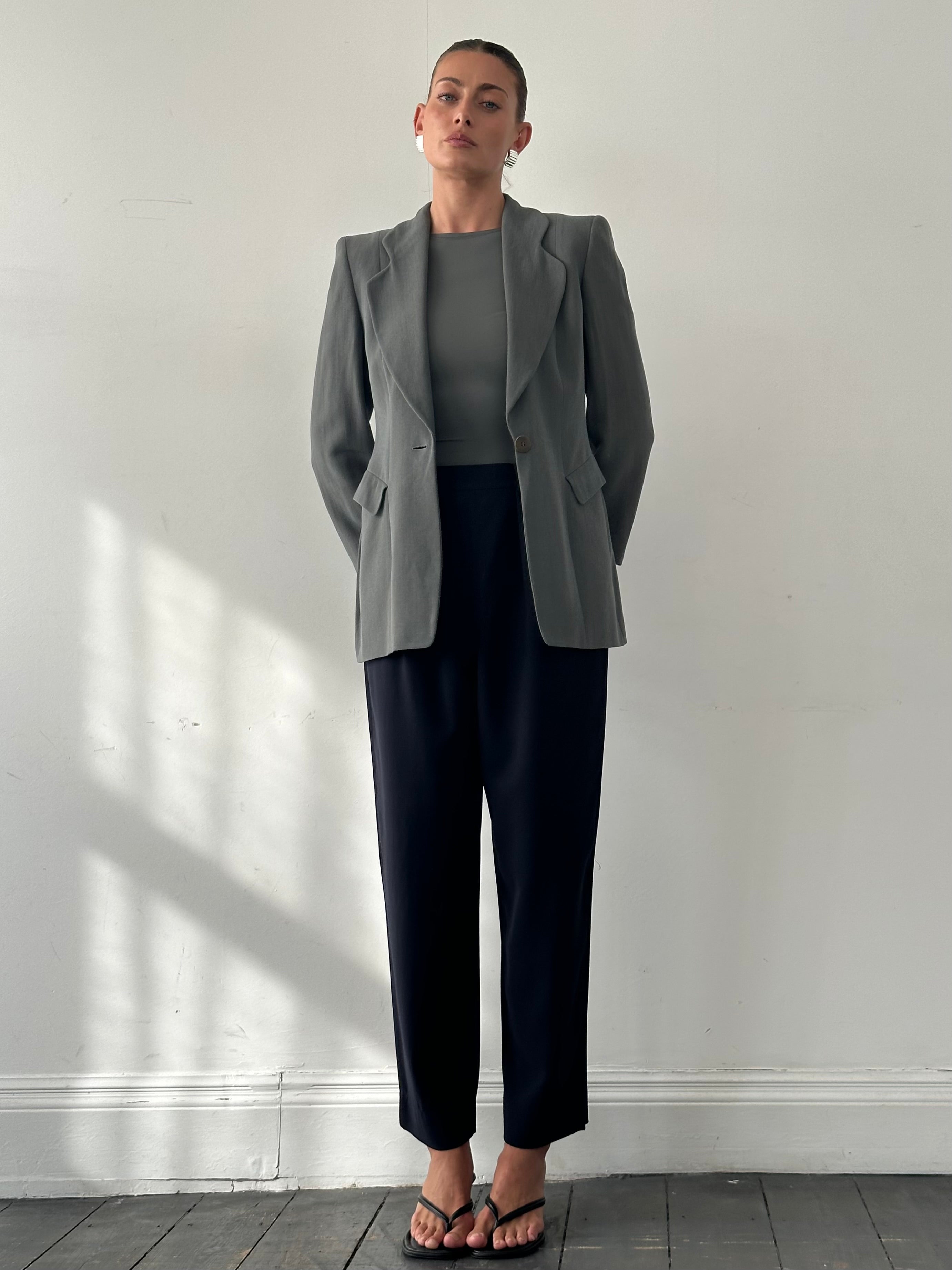 Giorgio Armani 1990s high-waisted pure wool tapered trousers in navy, with front pleats and tailored fit, size W28.