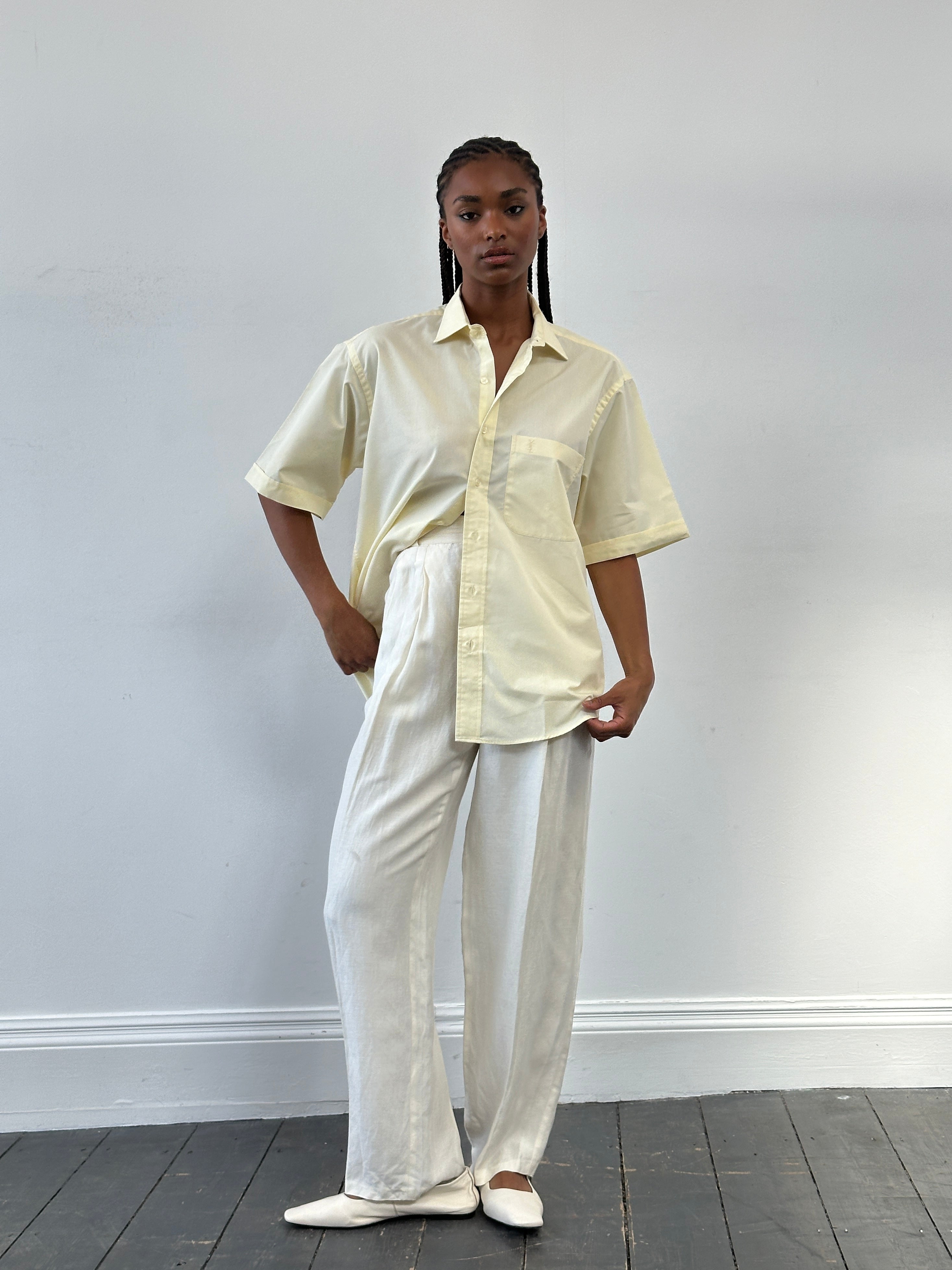 Versace 1980s silk linen high-waisted trousers in W22, showcasing elegant tailored design and luxurious fabric.