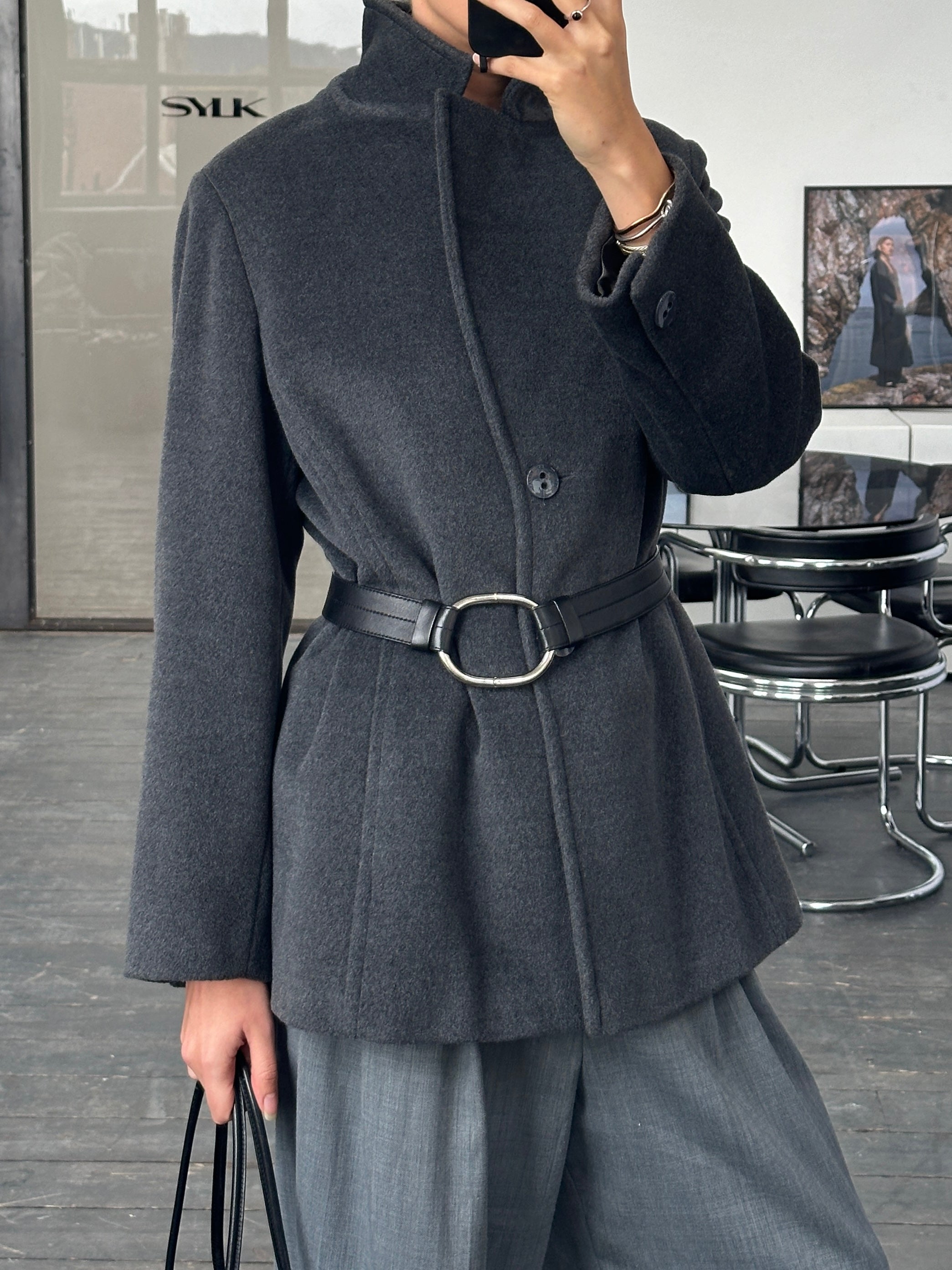 Krizia Virgin Wool Coat from the 1990s, casual fit, in a neutral color, featuring classic collar and button details.