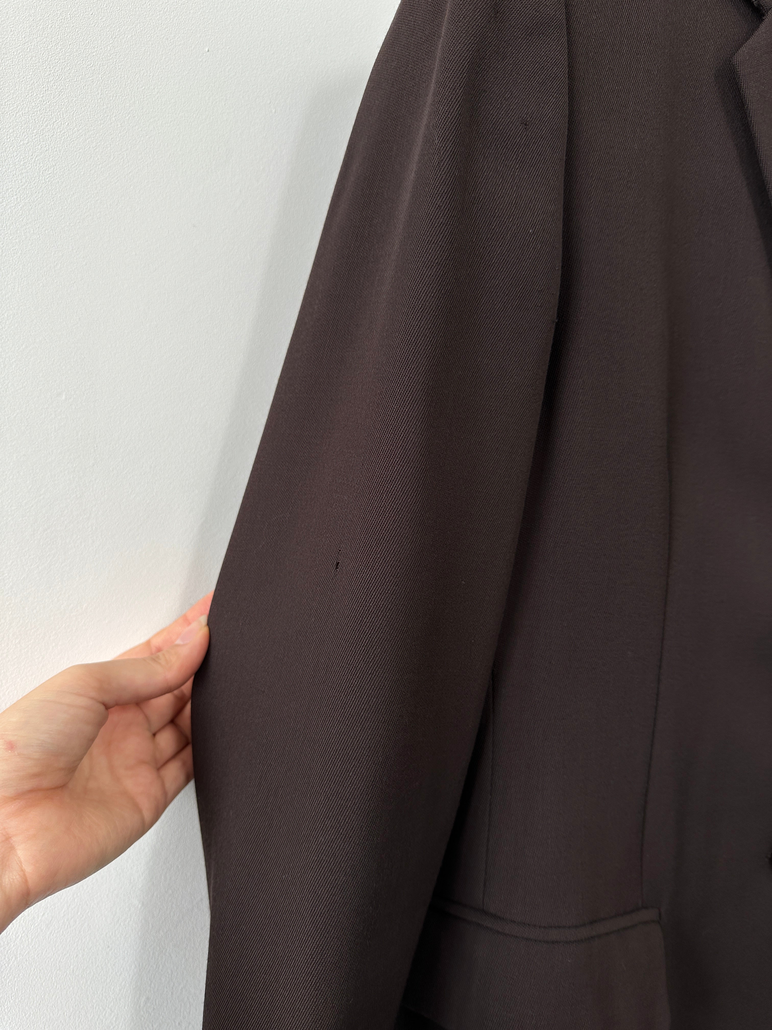 Max Mara virgin wool single-breasted blazer in size M, tailored fit with lapel collar and front buttons displayed on a hanger.