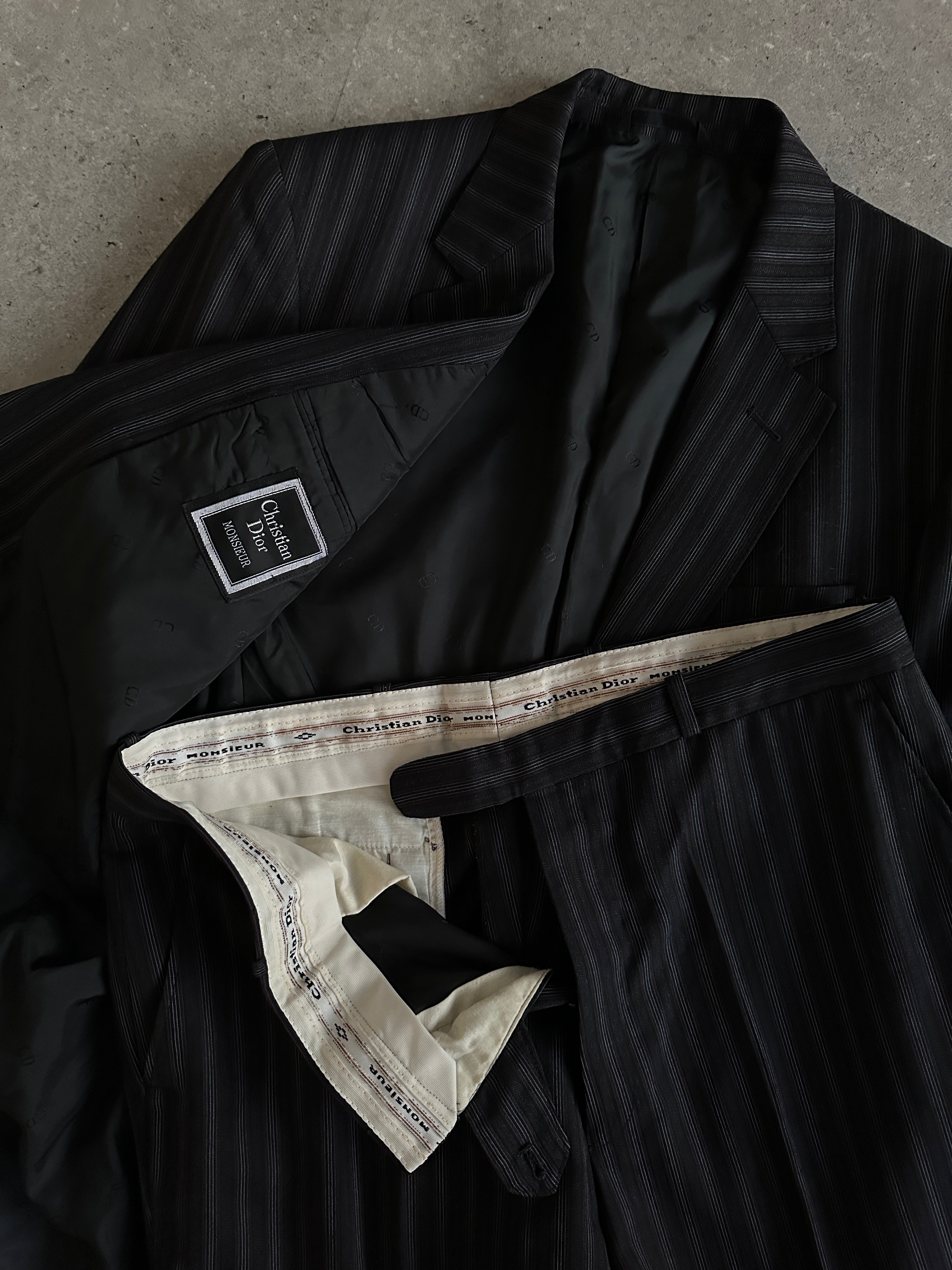 Christian Dior pure wool pinstripe jumpsuit in size 42L/W34, tailored fit with classic pinstripe pattern, elegant and sophisticated.