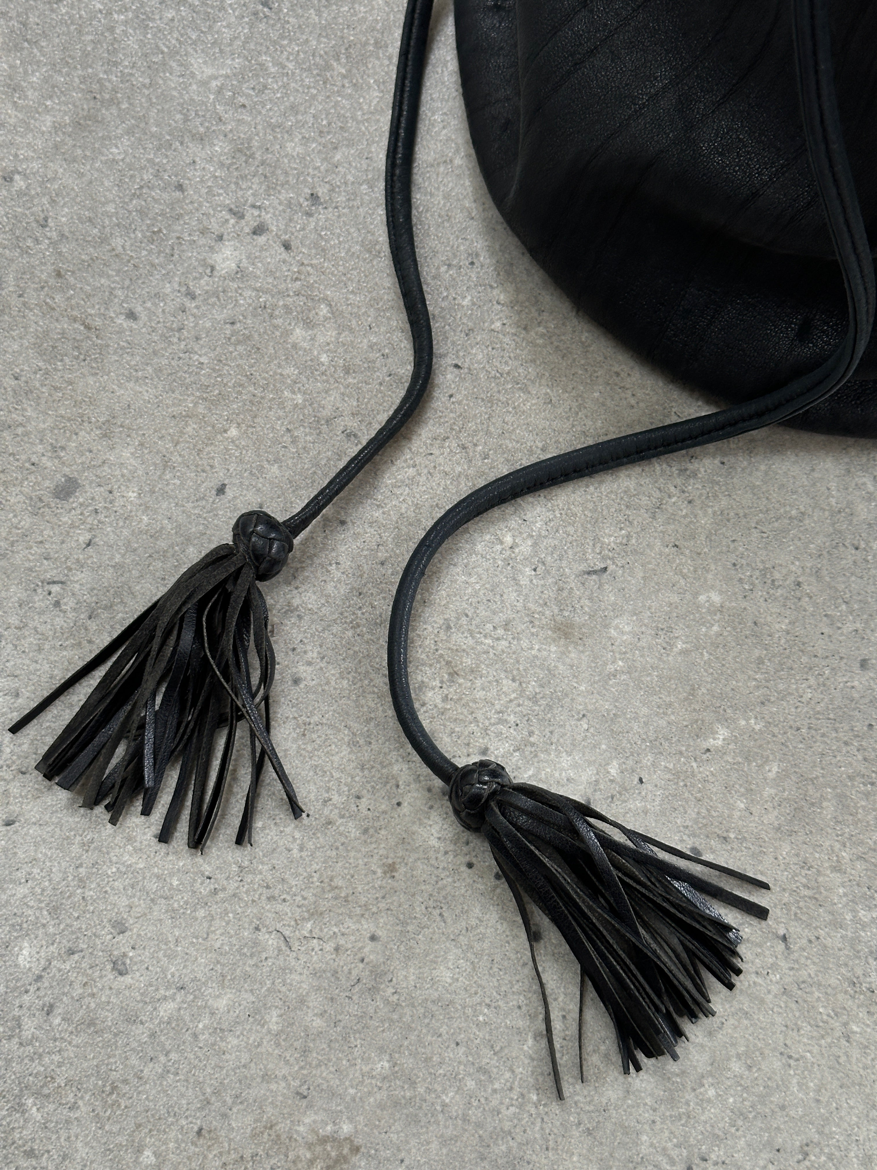 Giorgio Armani Le Collezioni leather rucksack bag with adjustable shoulder straps and minimalist design, in black leather.