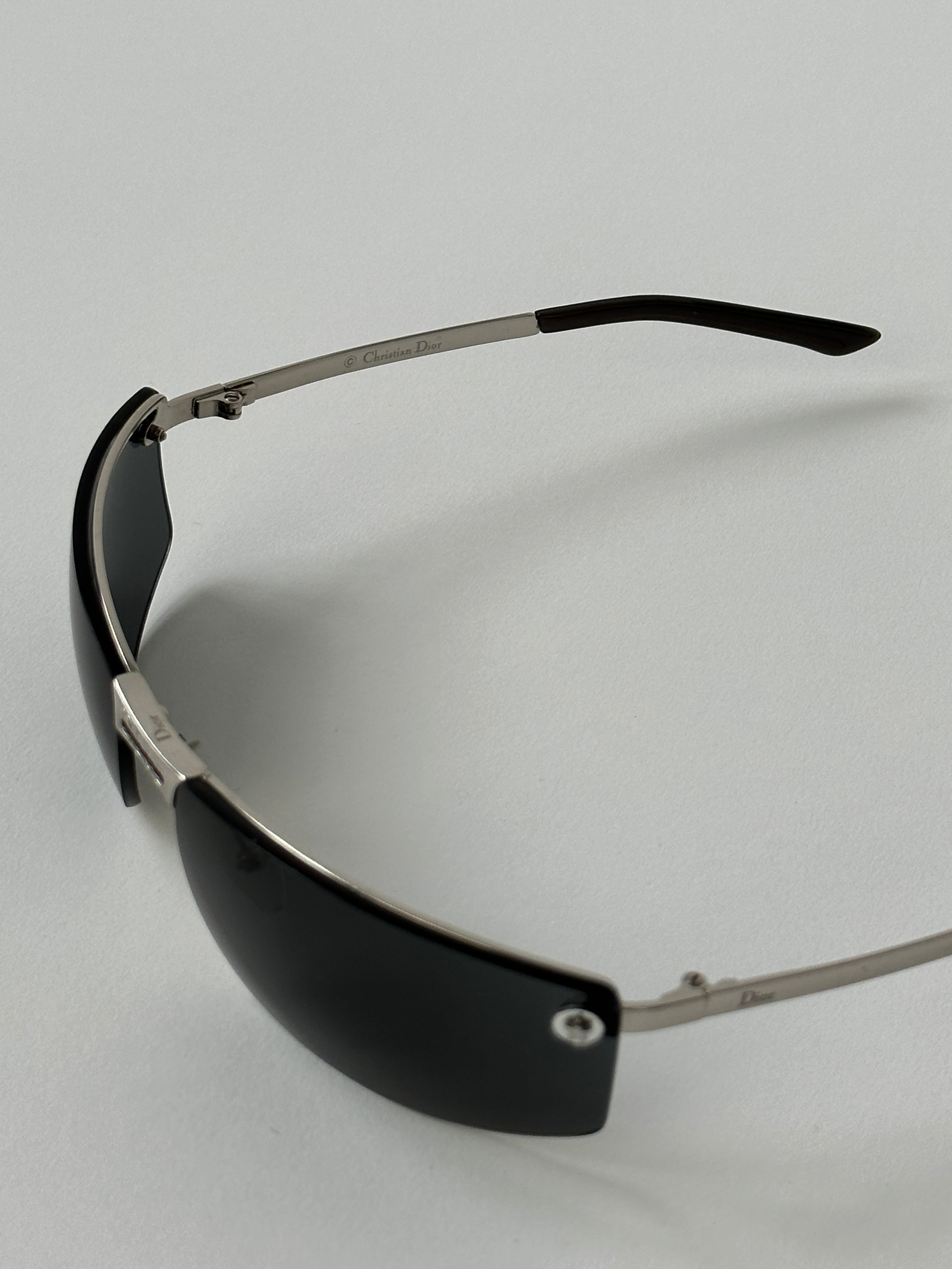Christian Dior 2000s rimless sunglasses with sleek, modern design and slim metal frames, stylish eyewear for contemporary fashion.