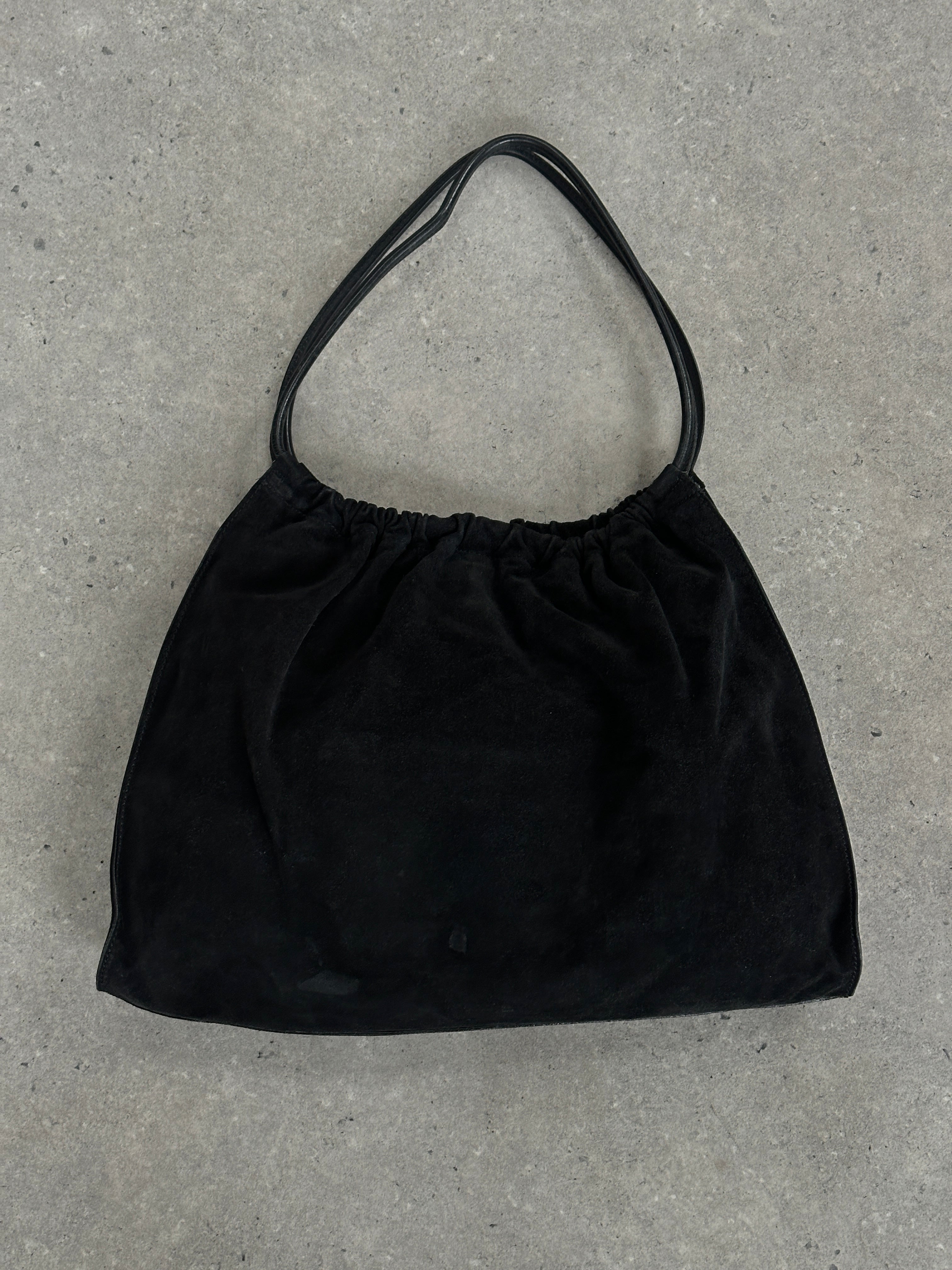 Gucci 1990s Tom Ford suede leather hobo shoulder bag with slouchy design and shoulder strap, vintage luxury accessory.