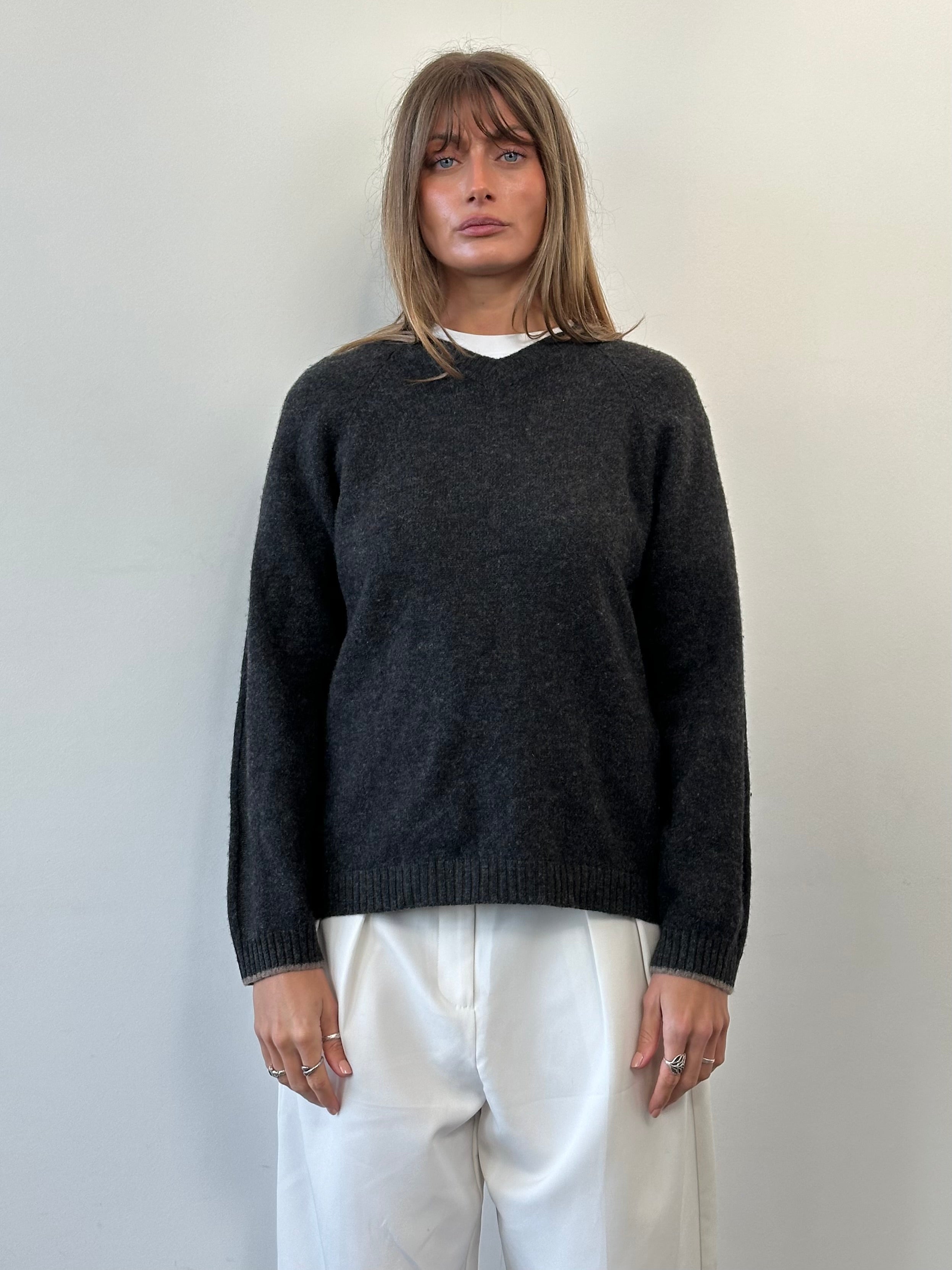Armani Jeans wool V-neck jumper in size M/L, featuring a soft knit fabric and classic design, displayed on a neutral background.