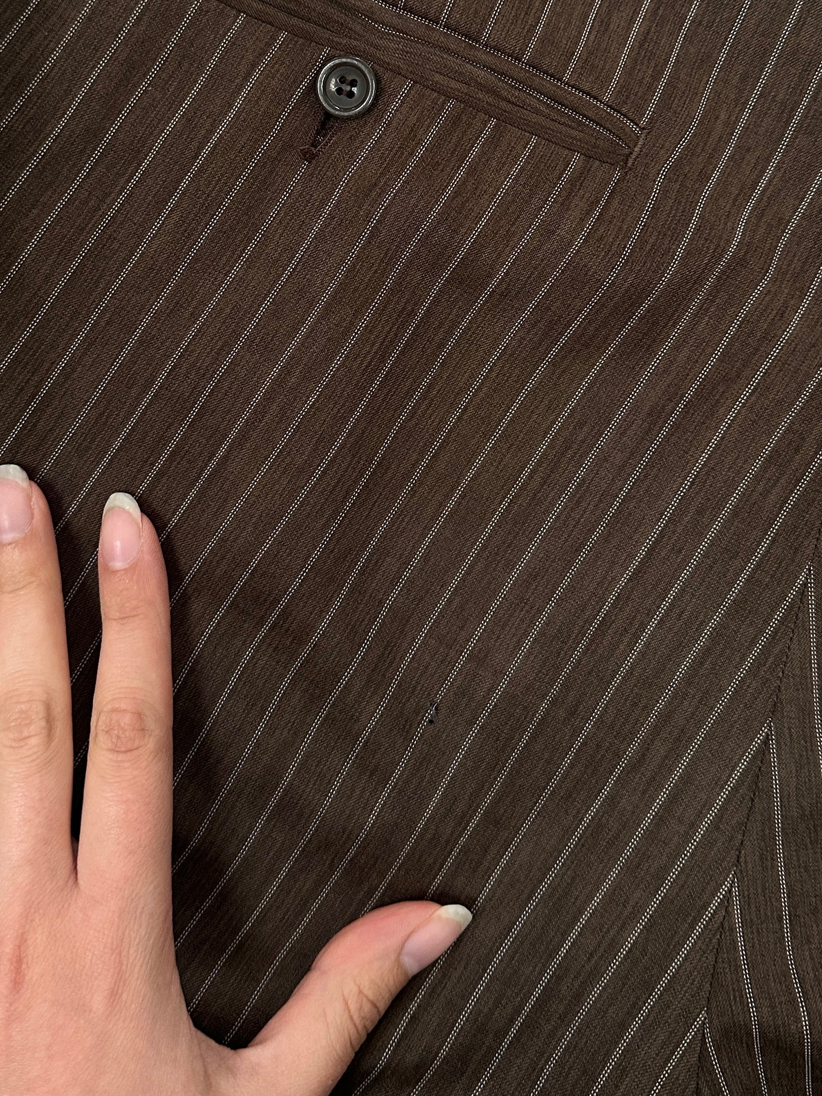 Vintage Italian vintage stripe wool three-piece suit, size 44R/W34, featuring tailored jacket, vest, and trousers with classic stripe pattern.