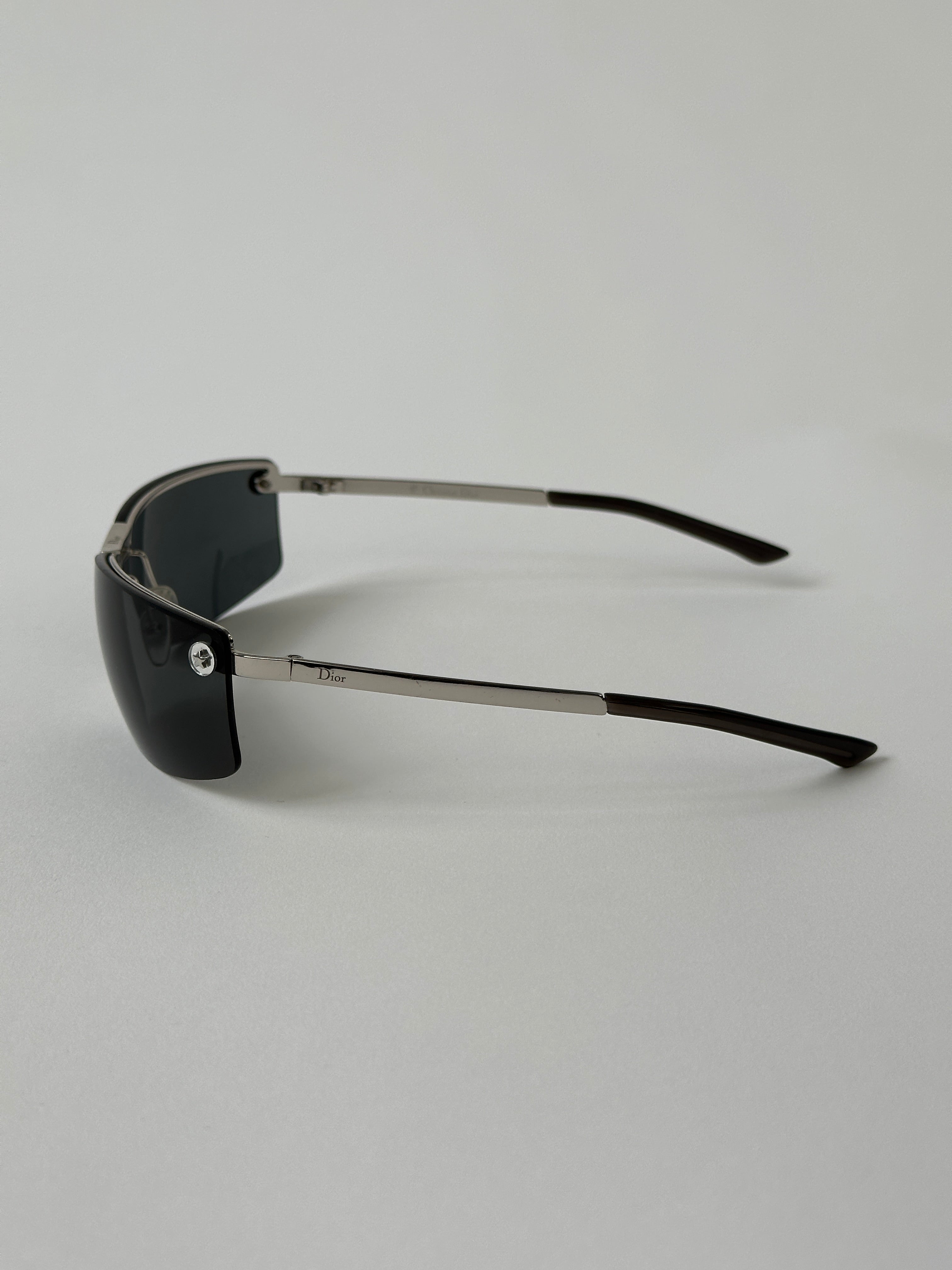 Christian Dior 2000s rimless sunglasses with sleek, minimalist design and tinted lenses, reflecting classic Dior eyewear style.
