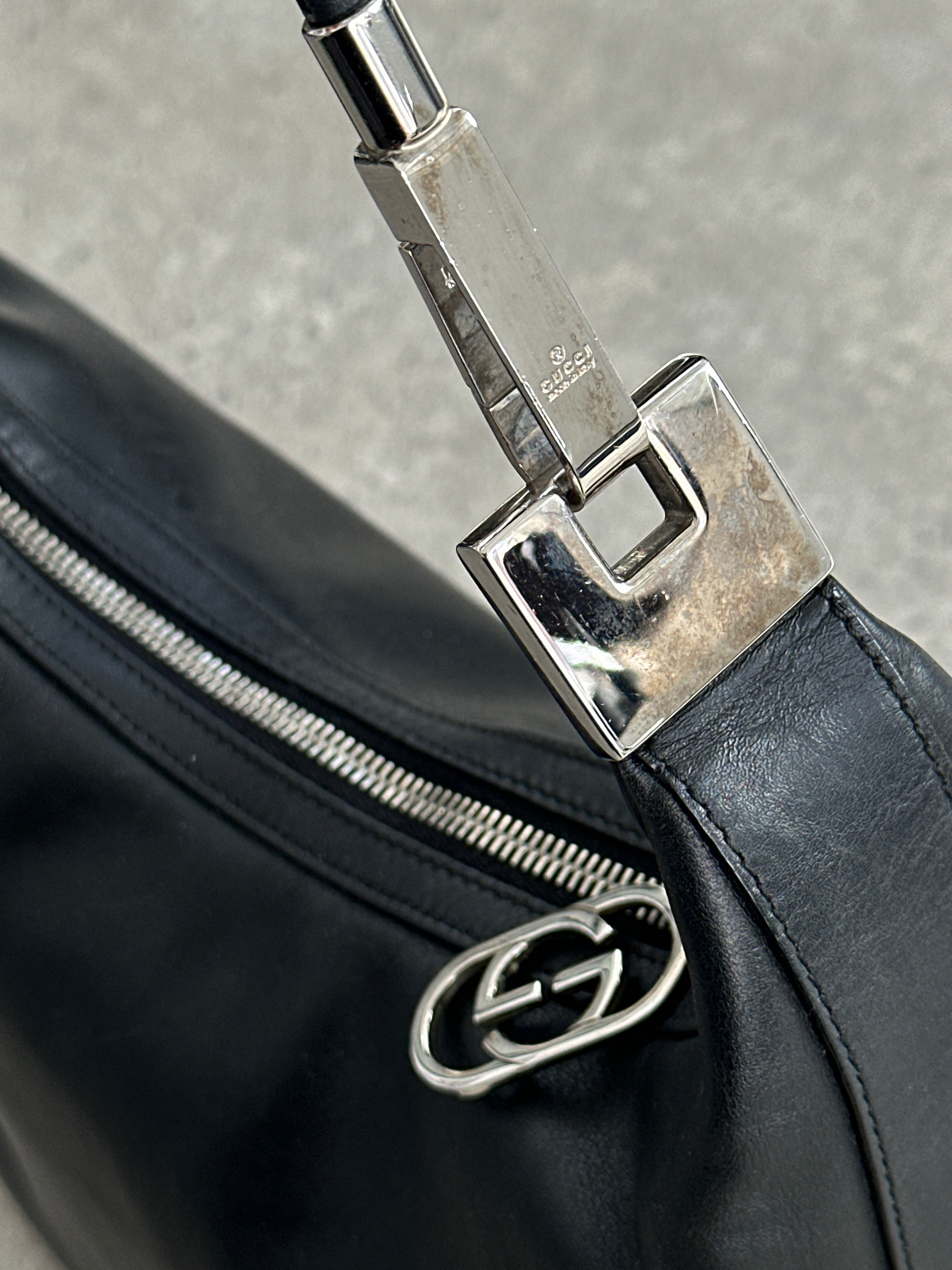 Gucci 1990s Tom Ford GG leather hobo shoulder bag with classic design and spacious interior, stylish and collectible accessory.