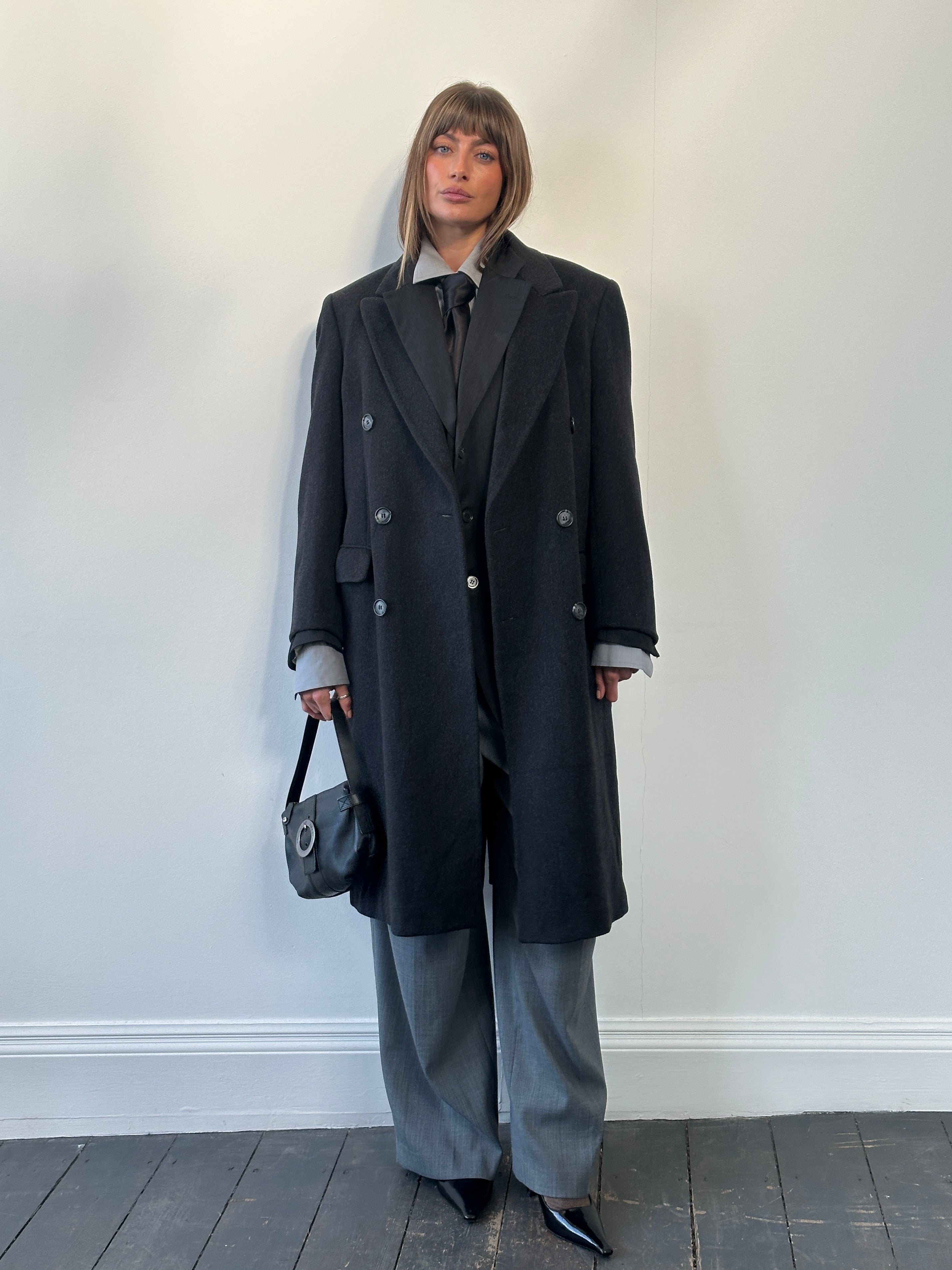 Vintage 1980s pure wool double-breasted coat in size large, classic style with lapels and button details.