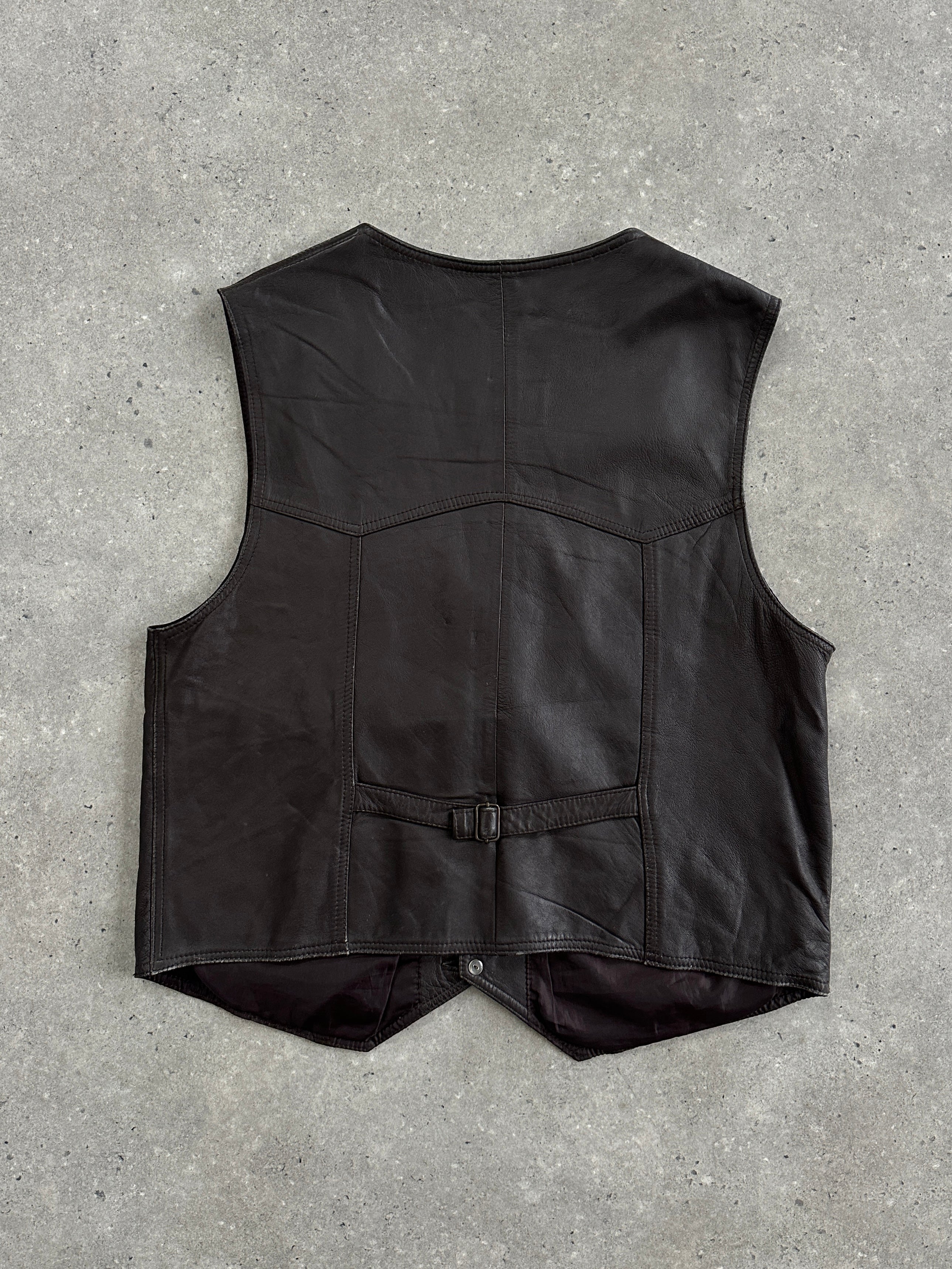 Vintage 1990s leather waistcoat in XL size, featuring classic distressed leather and retro style, photographed on a plain background.
