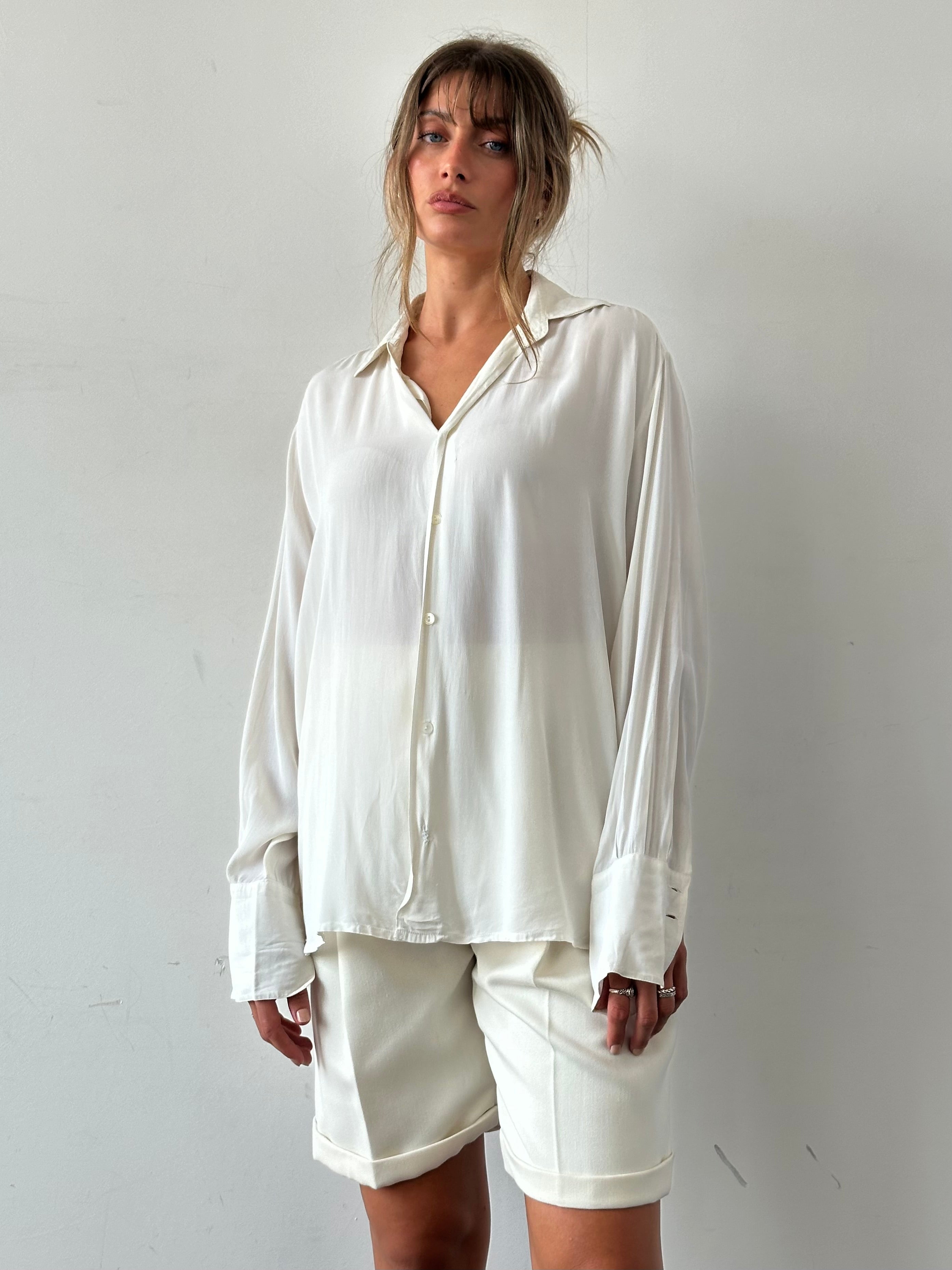 Vintage silk flowy shirt in size L, featuring a relaxed fit and elegant drape, showcasing the soft, shiny fabric and classic style.