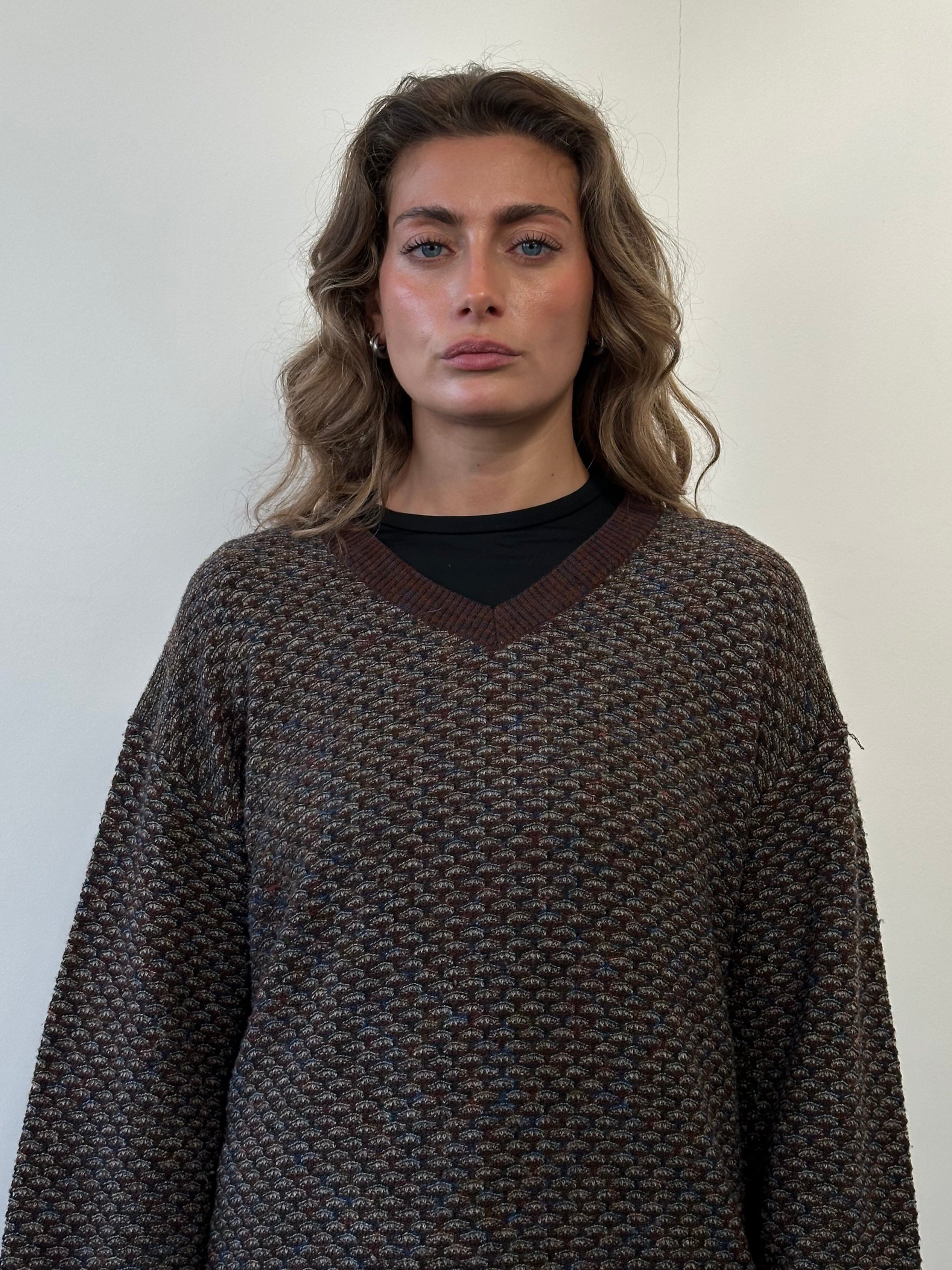 Missoni V-neck wool knitted jumper in size L, featuring colorful striped pattern and cozy knit texture.