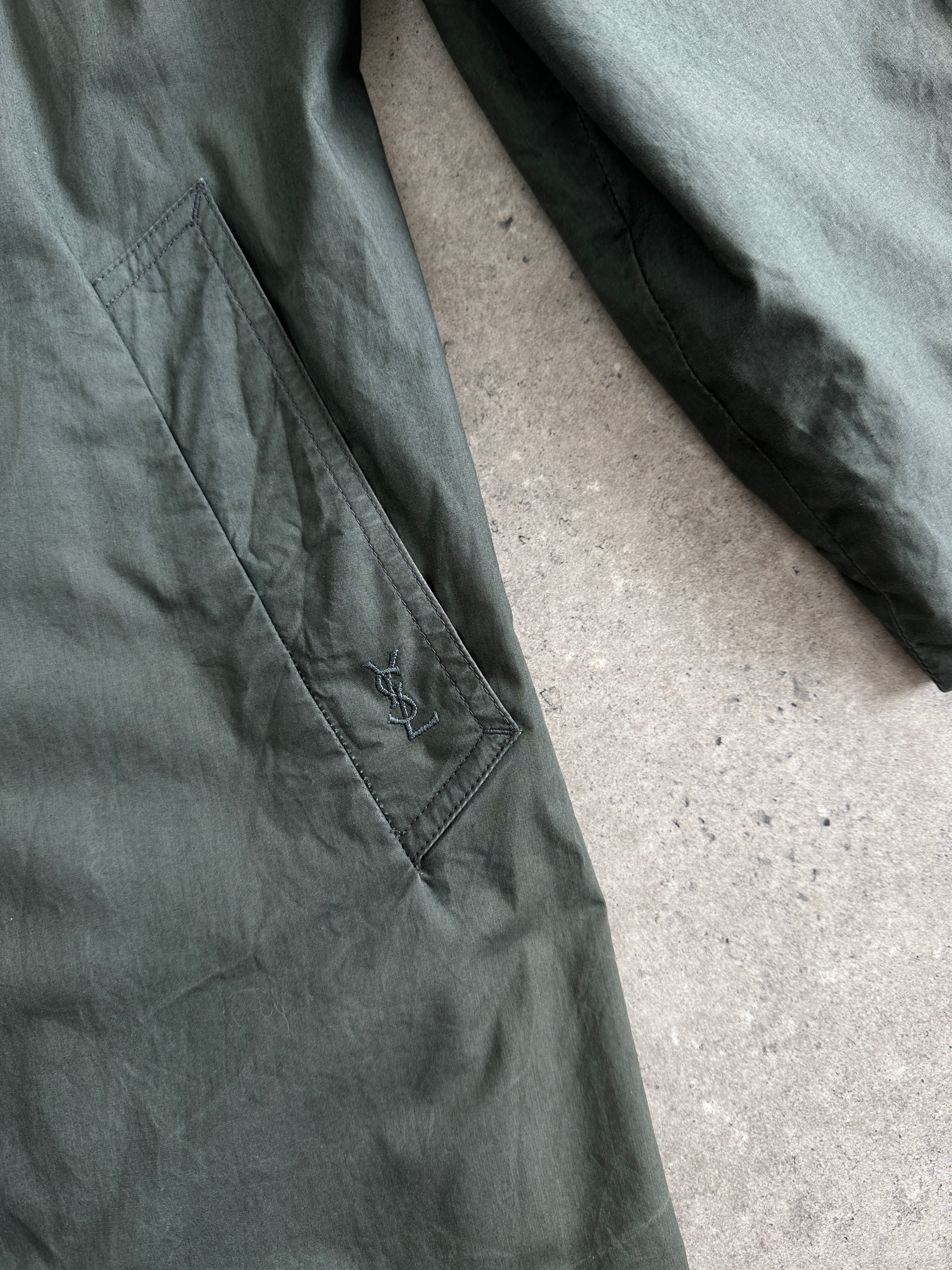 Yves Saint Laurent Diffusion Hommes pure cotton trench coat with concealed placket, shown in size L on a model.