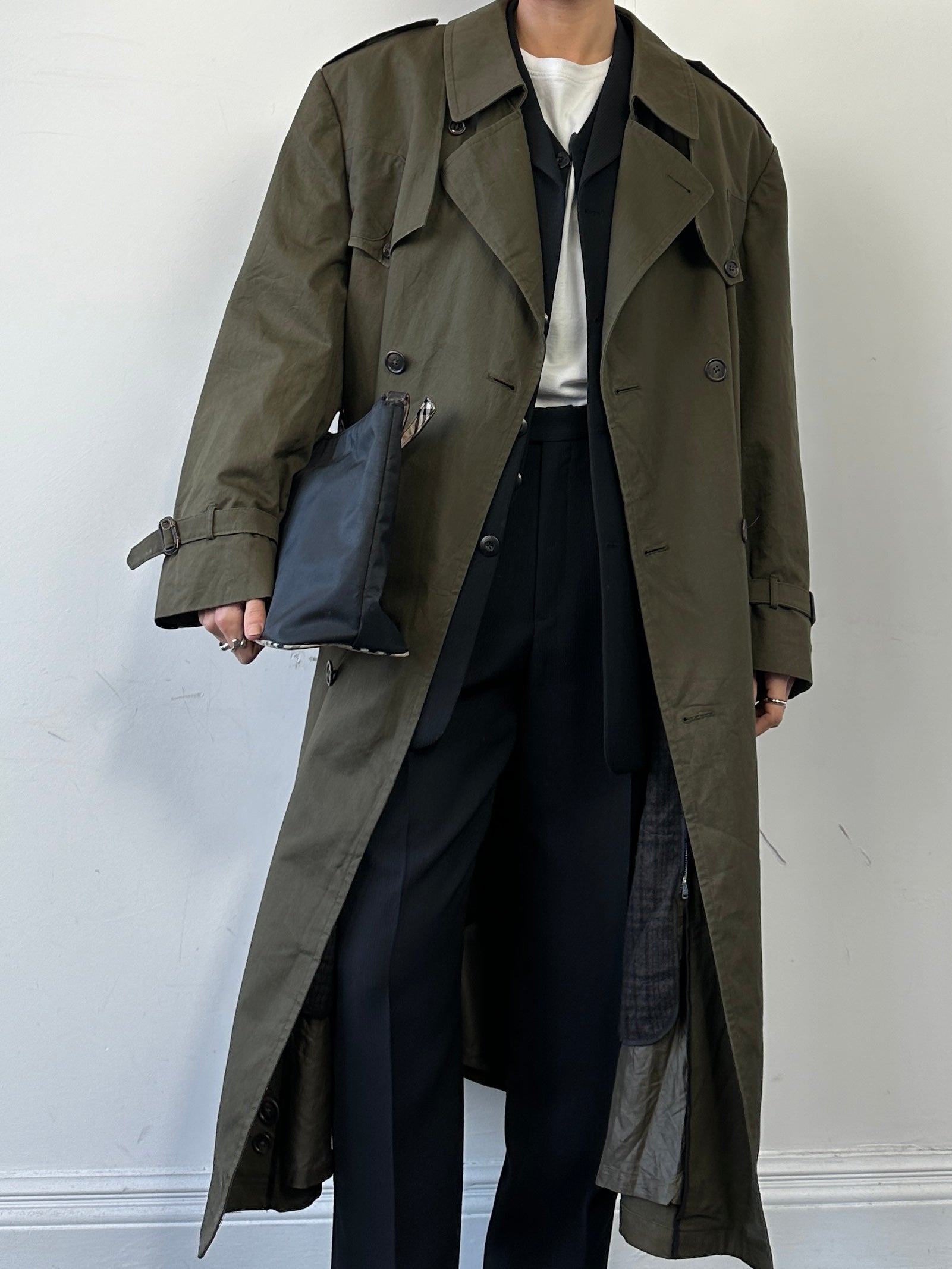 Christian Dior cotton double-breasted trench coat in XL, featuring classic design and stylish details, displayed on a hanger.