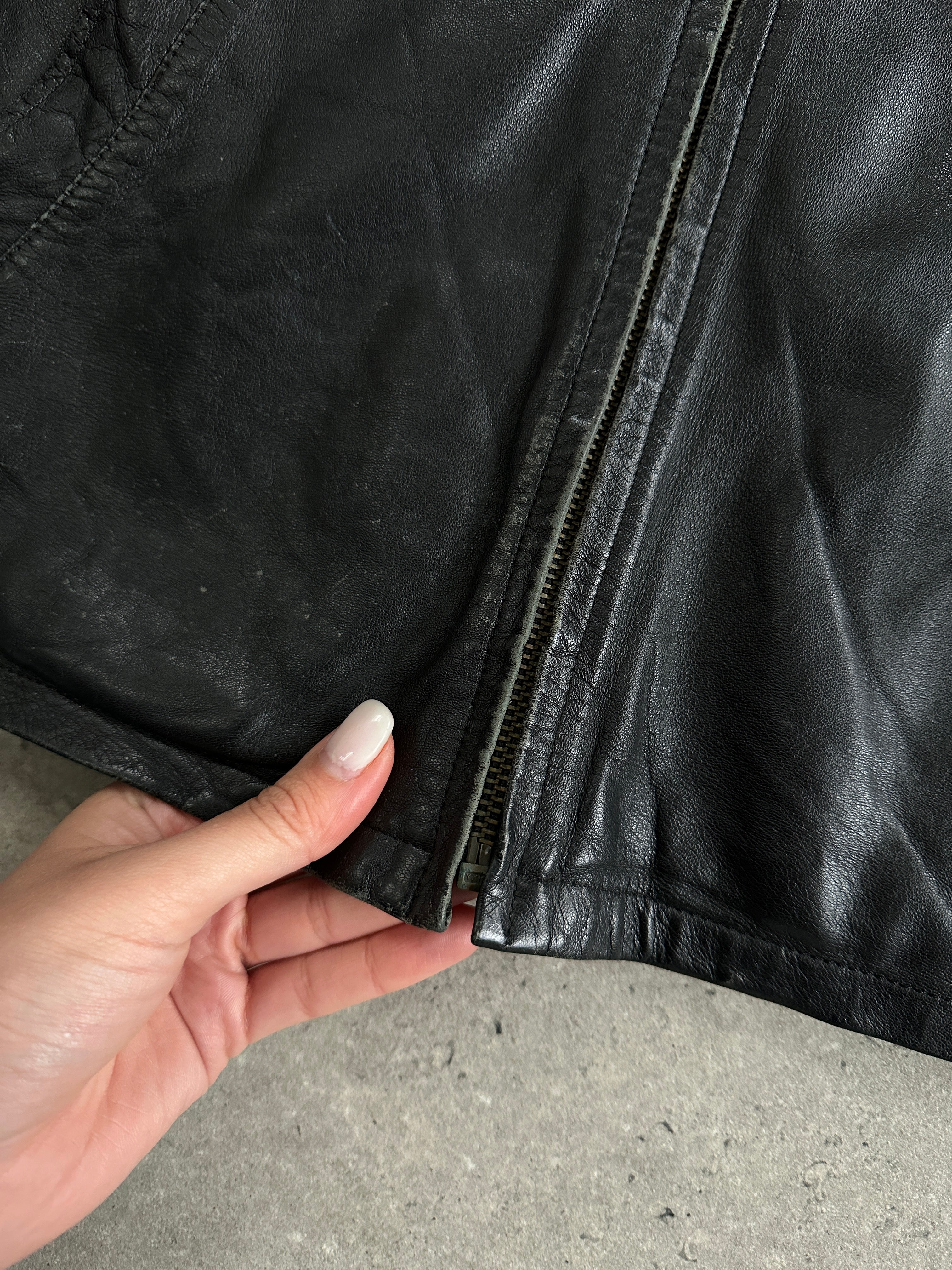 Conbipel zip-up leather jacket in size L, featuring a sleek black design and front zipper closure, stylish for men.