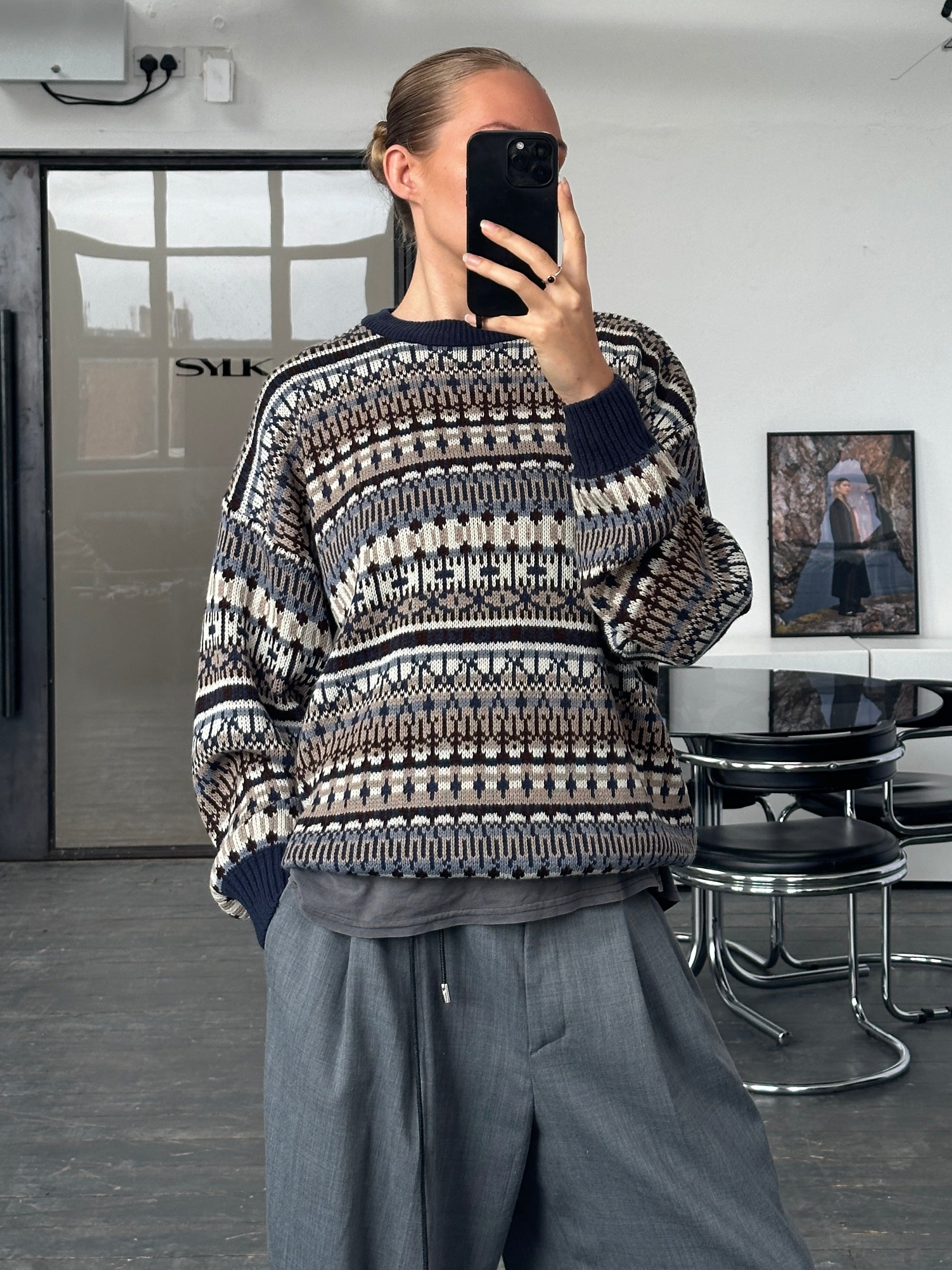 Vintage 1990s Fair Isle knitted jumper in size L/XL, featuring classic colorful geometric patterns and cozy wool texture.