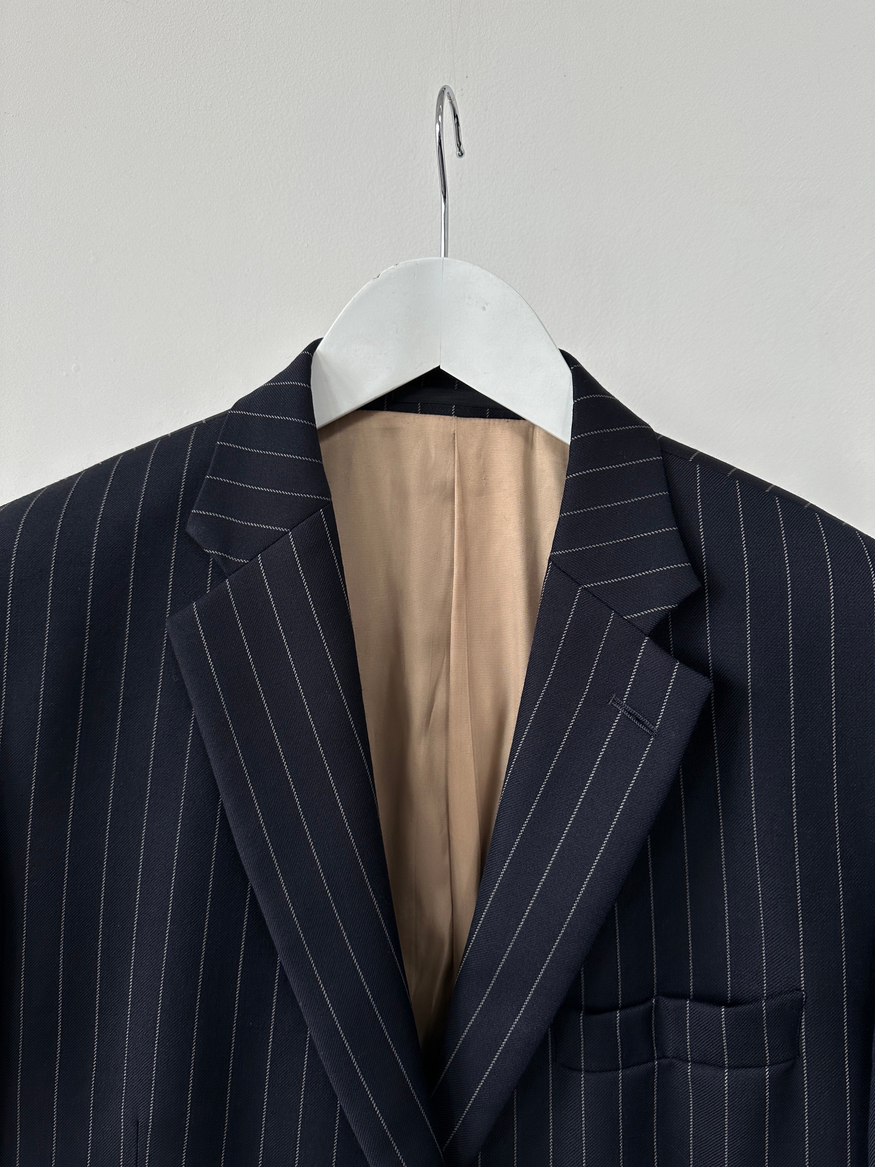 Vintage pinstripe wool blazer in size 42R/XL, single-breasted style with classic notch lapels and tailored fit.