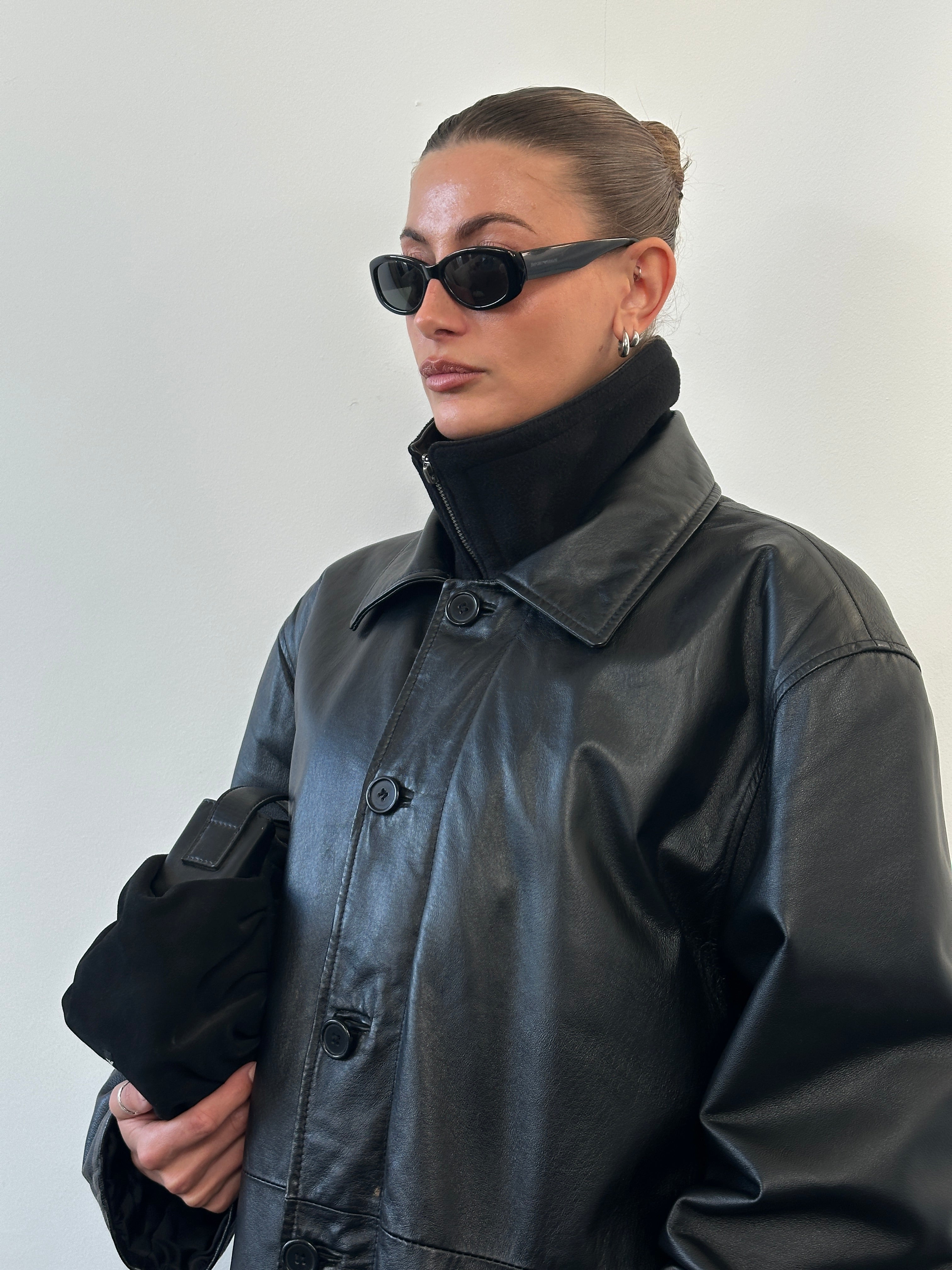 Vintage 1990s funnel neck leather jacket in XXL, stylish men's leather jacket with a classic vintage design and leather texture.