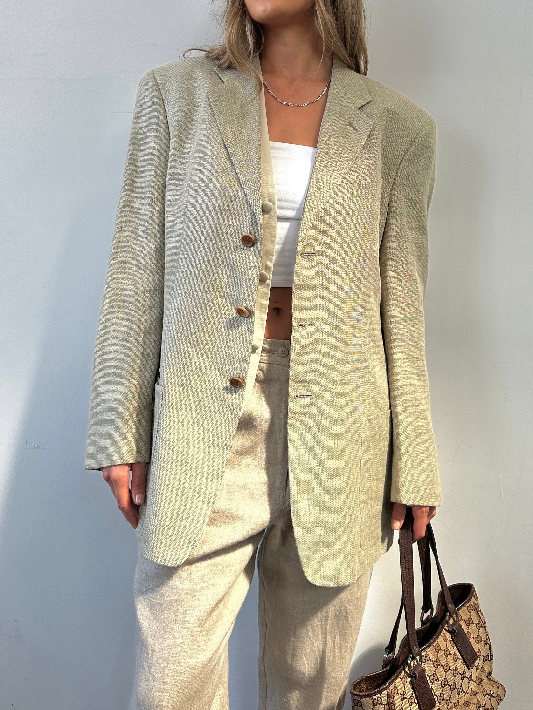 Armani Collezioni linen wool single-breasted blazer in size 42R/L, with notch lapels and tailored fit, displayed on a hanger.