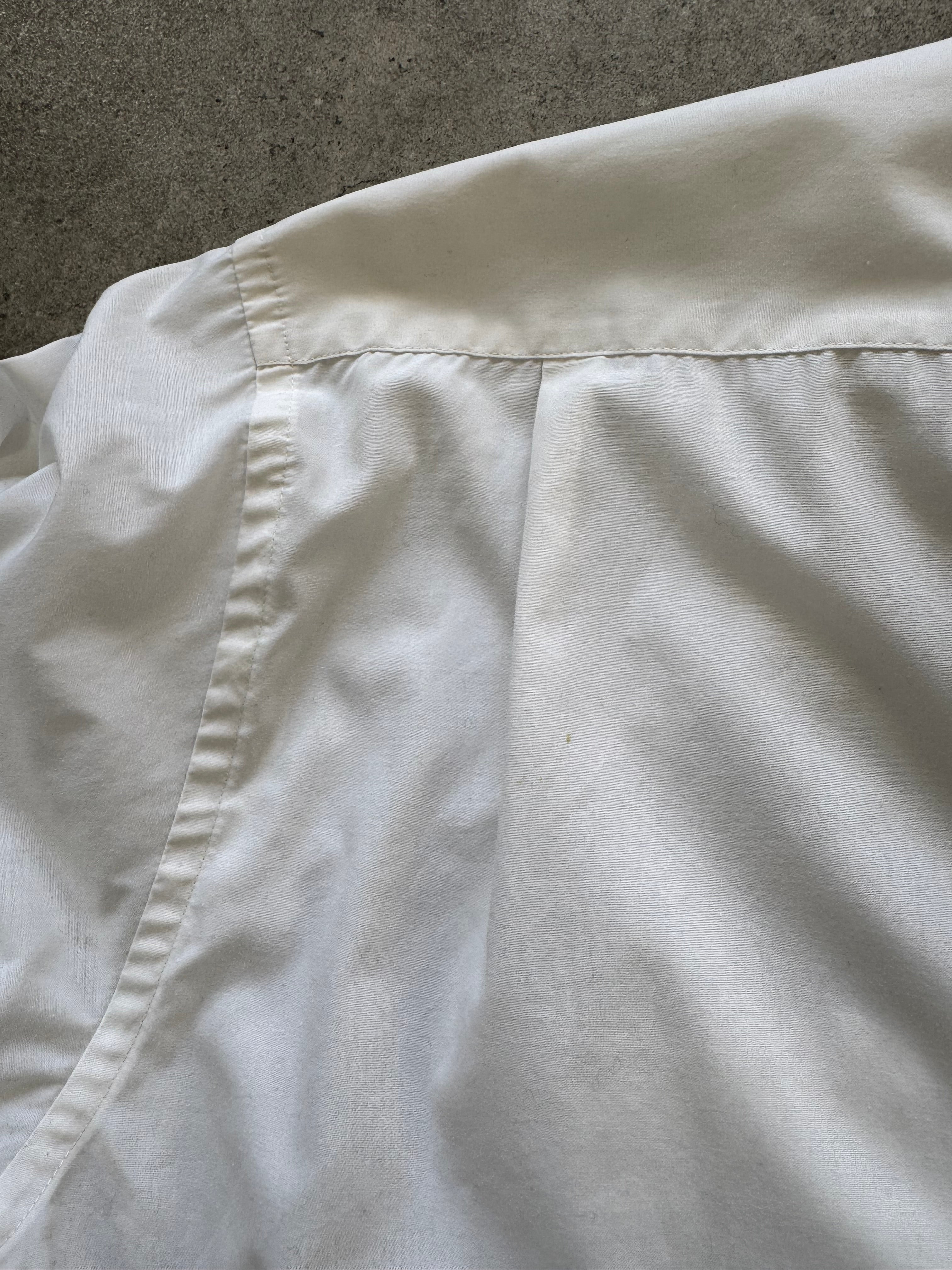 Yves Saint Laurent Pour Homme 1990s white cotton logo shirt, men's size M, with YSL branding on the front.