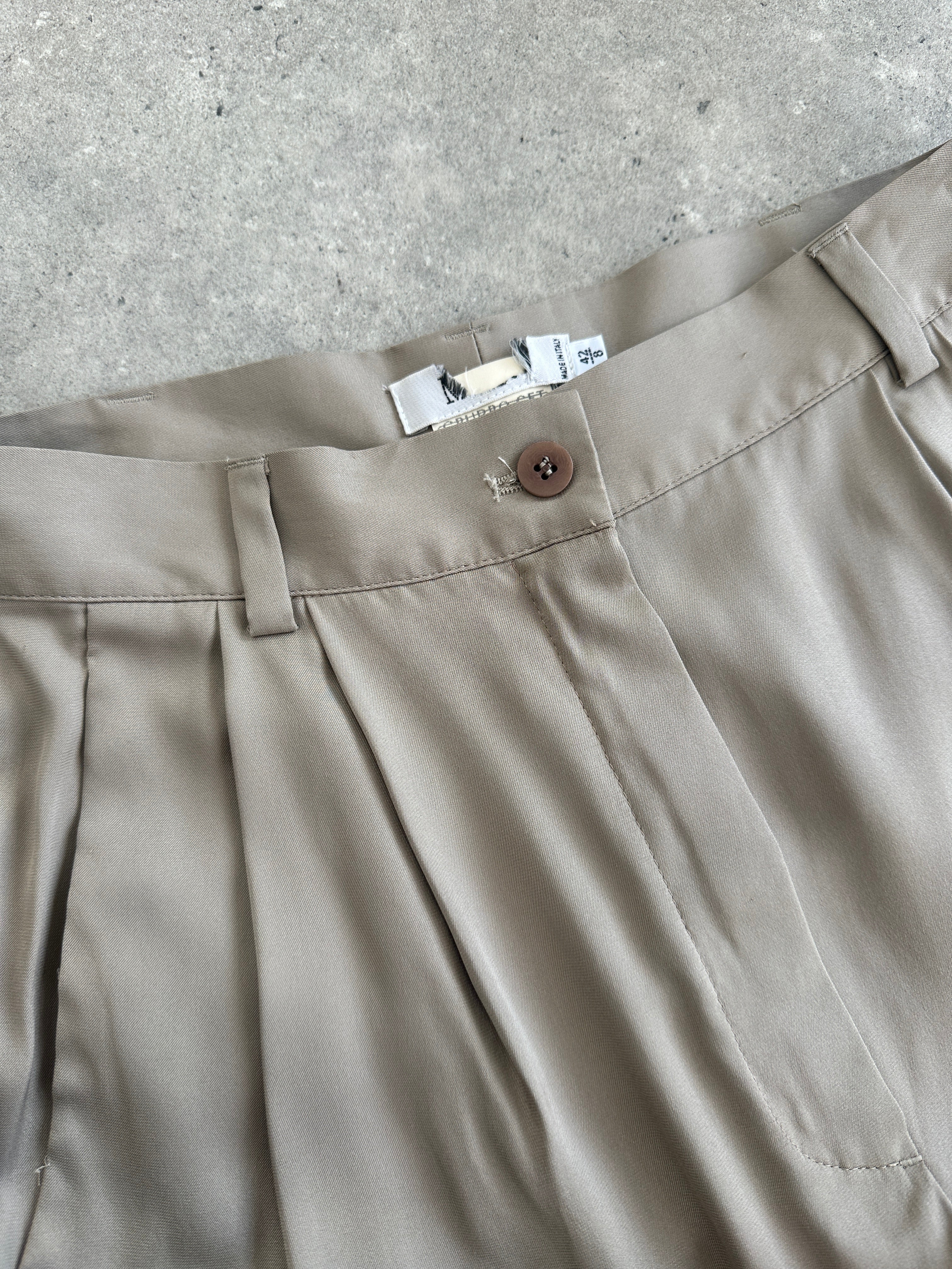 Mani Pure Silk high-waisted trousers in black, size W26, featuring a sleek, tailored fit and smooth silk fabric.