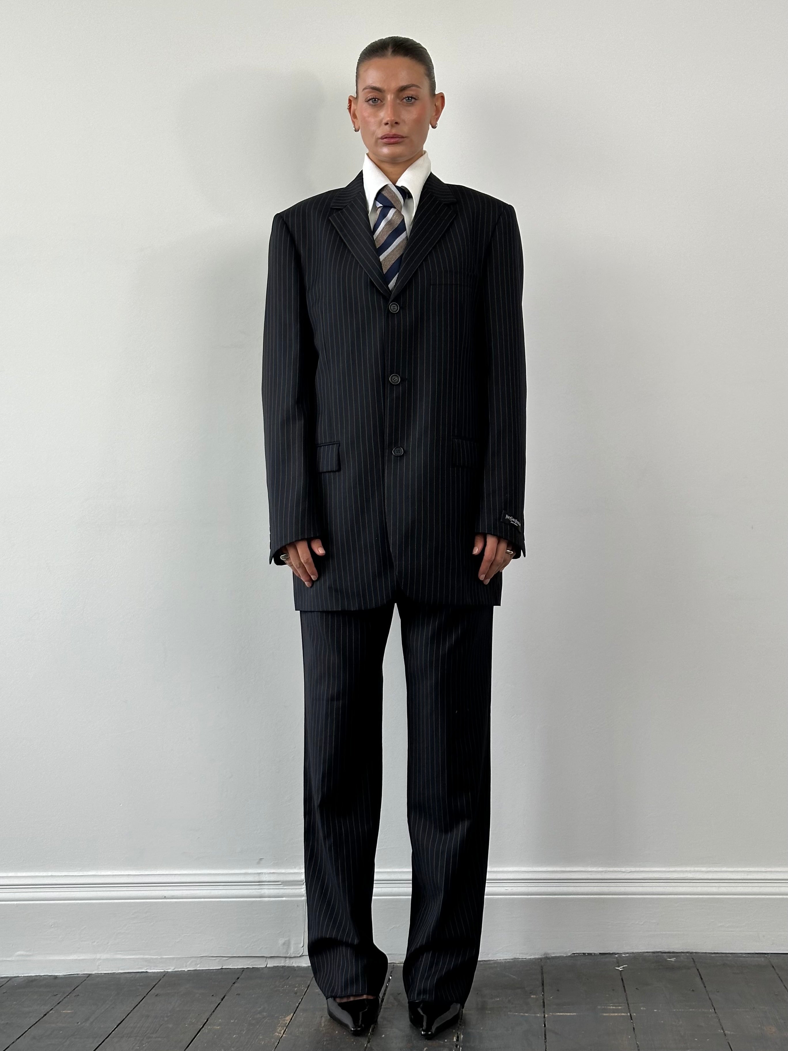 Yves Saint Laurent 1990s men's wool pinstripe single-breasted suit in size 40L/W32, featuring classic tailored fit and notch lapels.
