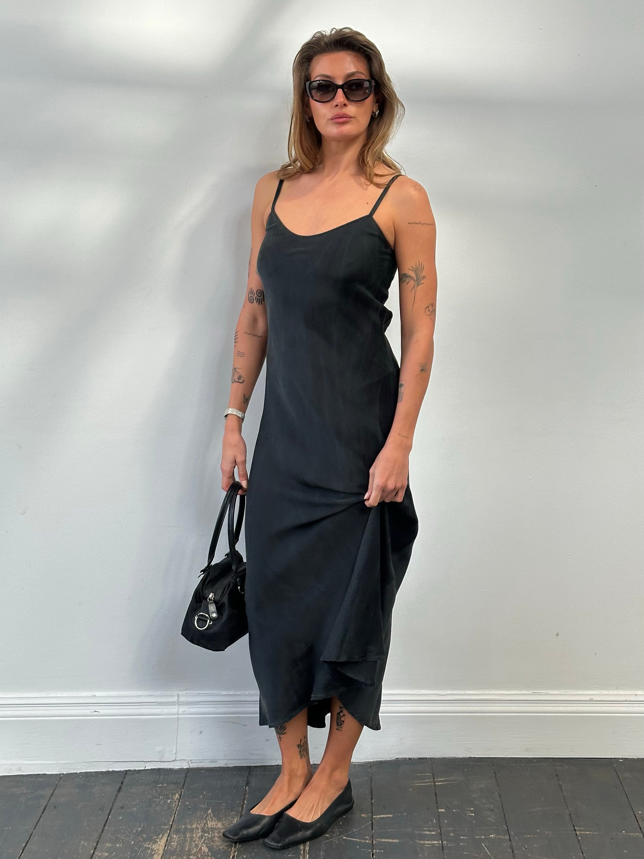 Vintage 1990s pure silk floor-length slip dress, size small, showcasing smooth fabric and elegant silhouette.