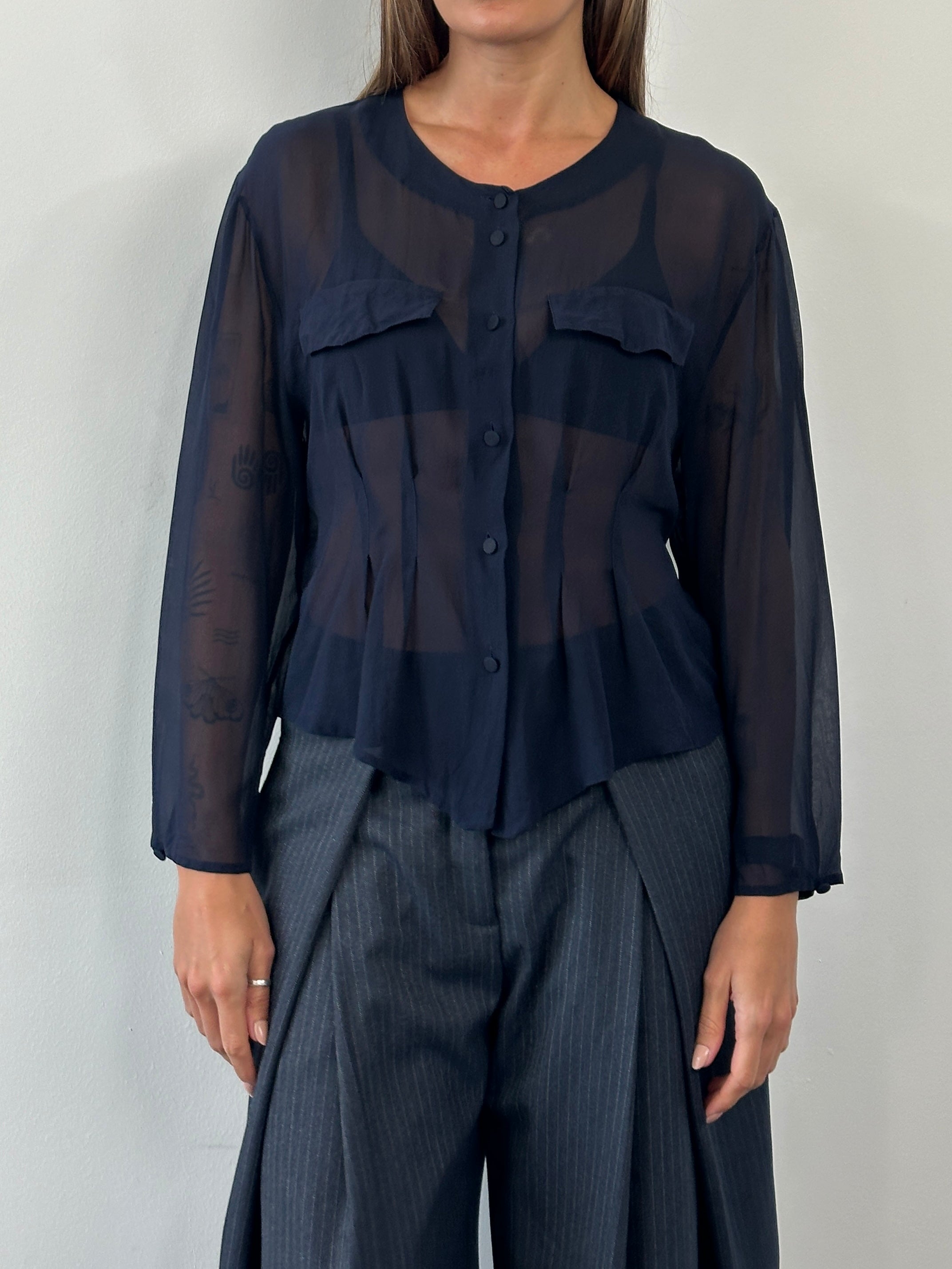 Vintage 1990s pure silk sheer shirt in size M, featuring a lightweight, elegant design with a classic collar and button front.